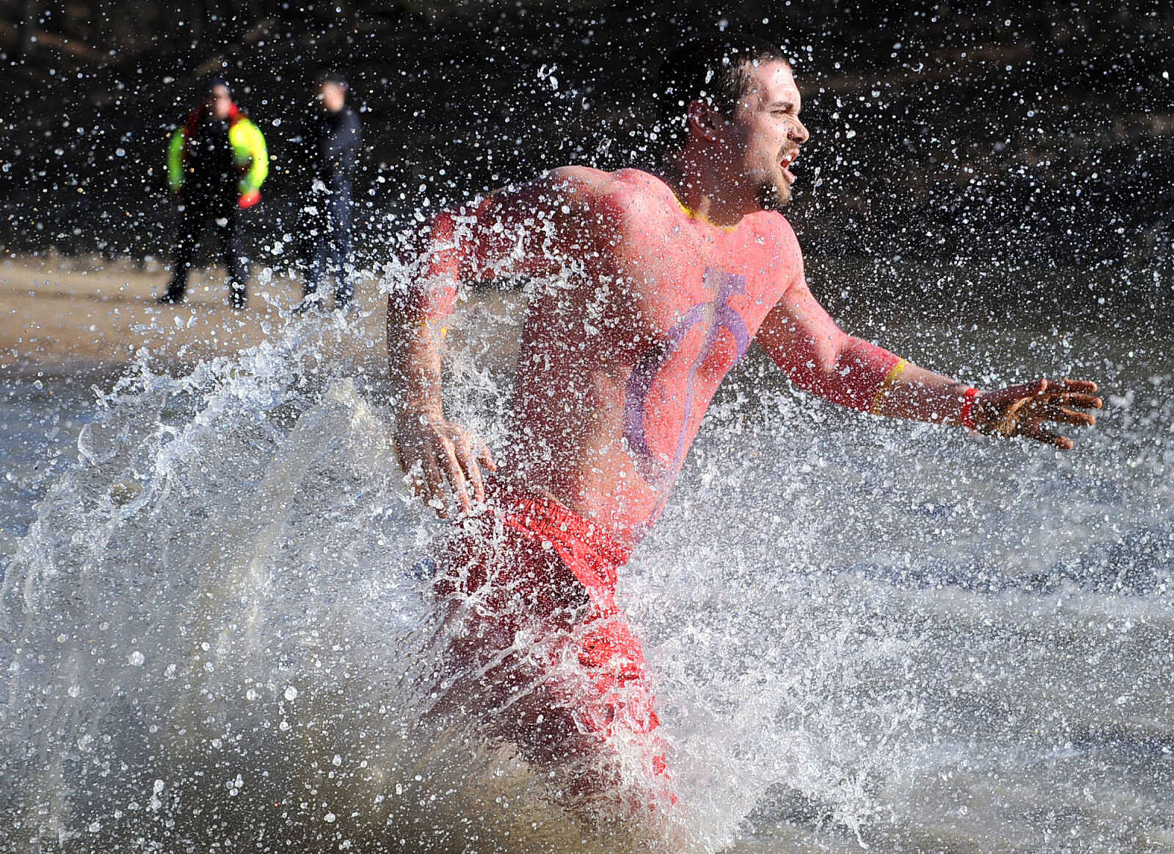 LAURA SIMON ~ lsimon@semissourian.com
People plunge into the cold waters of Lake Boutin Saturday afternoon, Feb. 2, 2013 during the Polar Plunge at Trail of Tears State Park. Thirty-six teams totaling 291 people took the annual plunge that benefits Special Olympics Missouri.