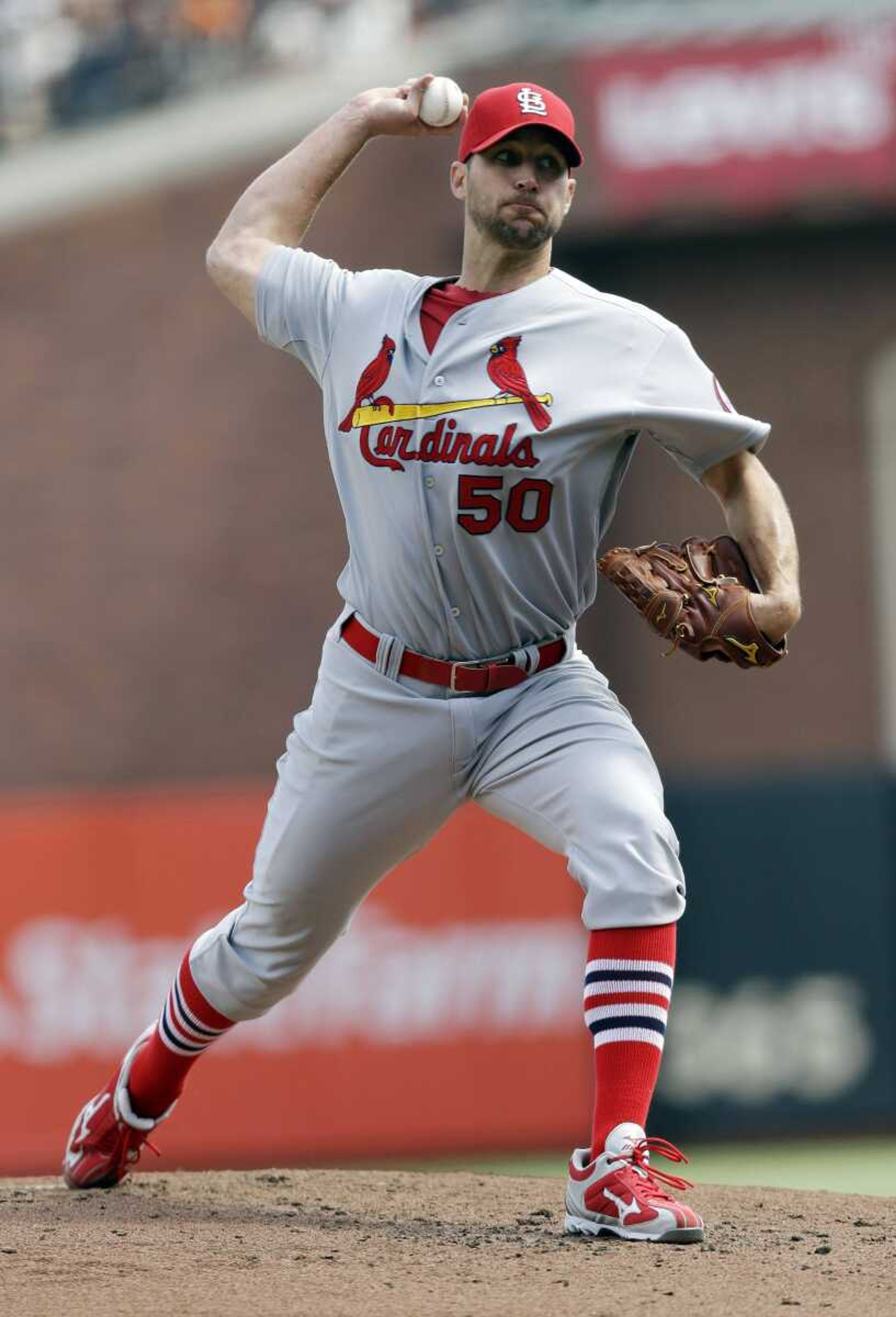 The Cardinals&#8217; starting pitcher Adam Wainwright brings one home during Sunday&#8217;s game in San Francisco. (Marcio Jose Sanchez ~ Associated Press)