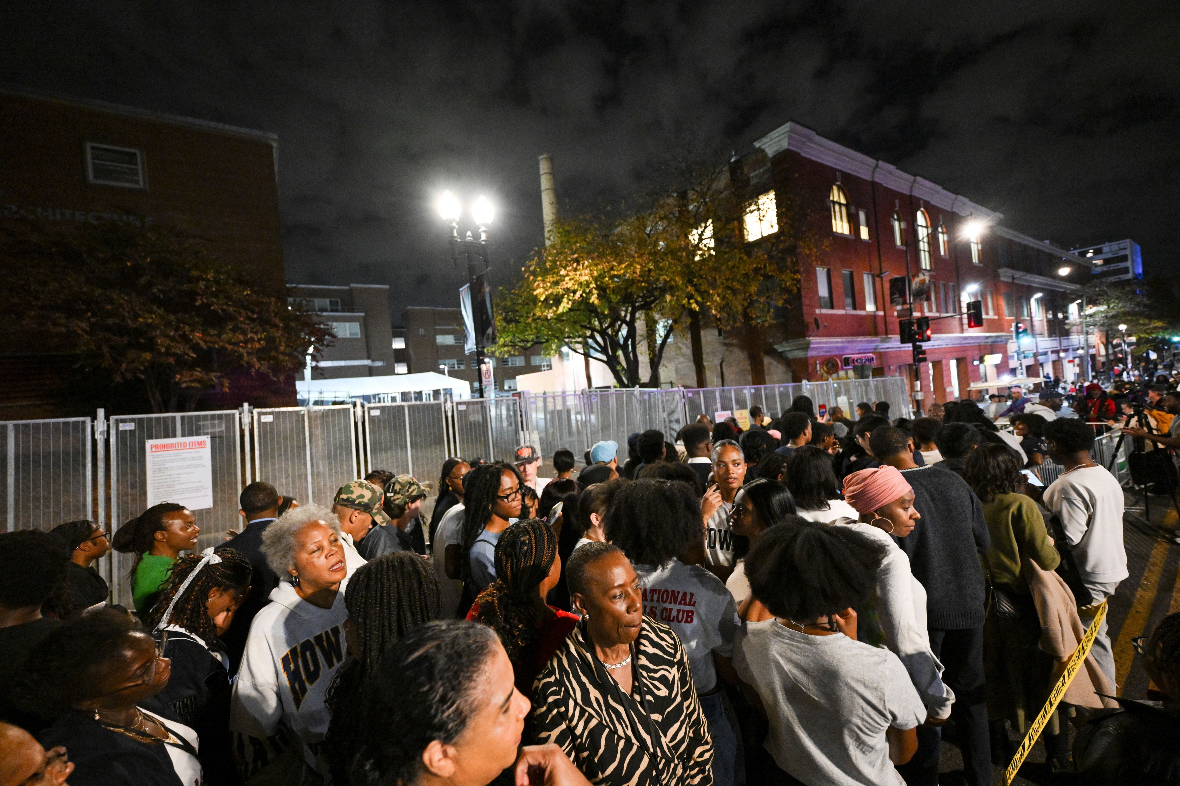 People gather near the entrance to Democratic presidential nominee Vice President Kamala Harris' election night watch party at Howard University, Tuesday, Nov. 5, 2024, in Washington. (AP Photo/Terrance Williams)