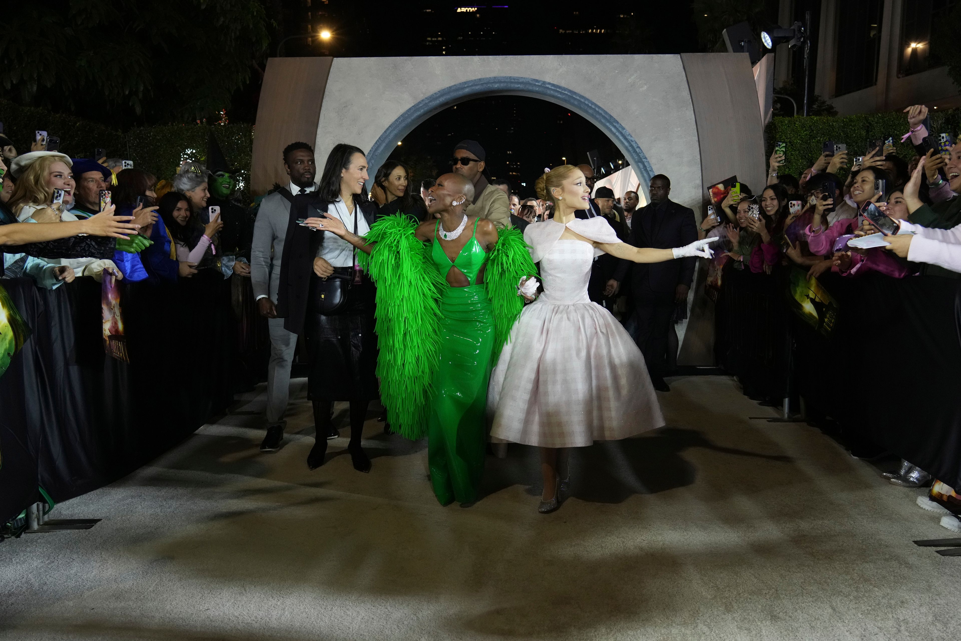 FILE - Cynthia Erivo, left, and Ariana Grande arrive at the premiere of "Wicked" on Saturday, Nov. 9, 2024, at Dorothy Chandler Pavilion in Los Angeles. In “Wicked,” Elphaba and Glinda travel from Shiz University to the Emerald City on a glistening green train to meet the wizard. In real life, Cynthia Erivo and Ariana Grande have traveled much farther and wider and longer and on airplanes to promote their hotly anticipated film. (Photo by Jordan Strauss/Invision/AP, File)