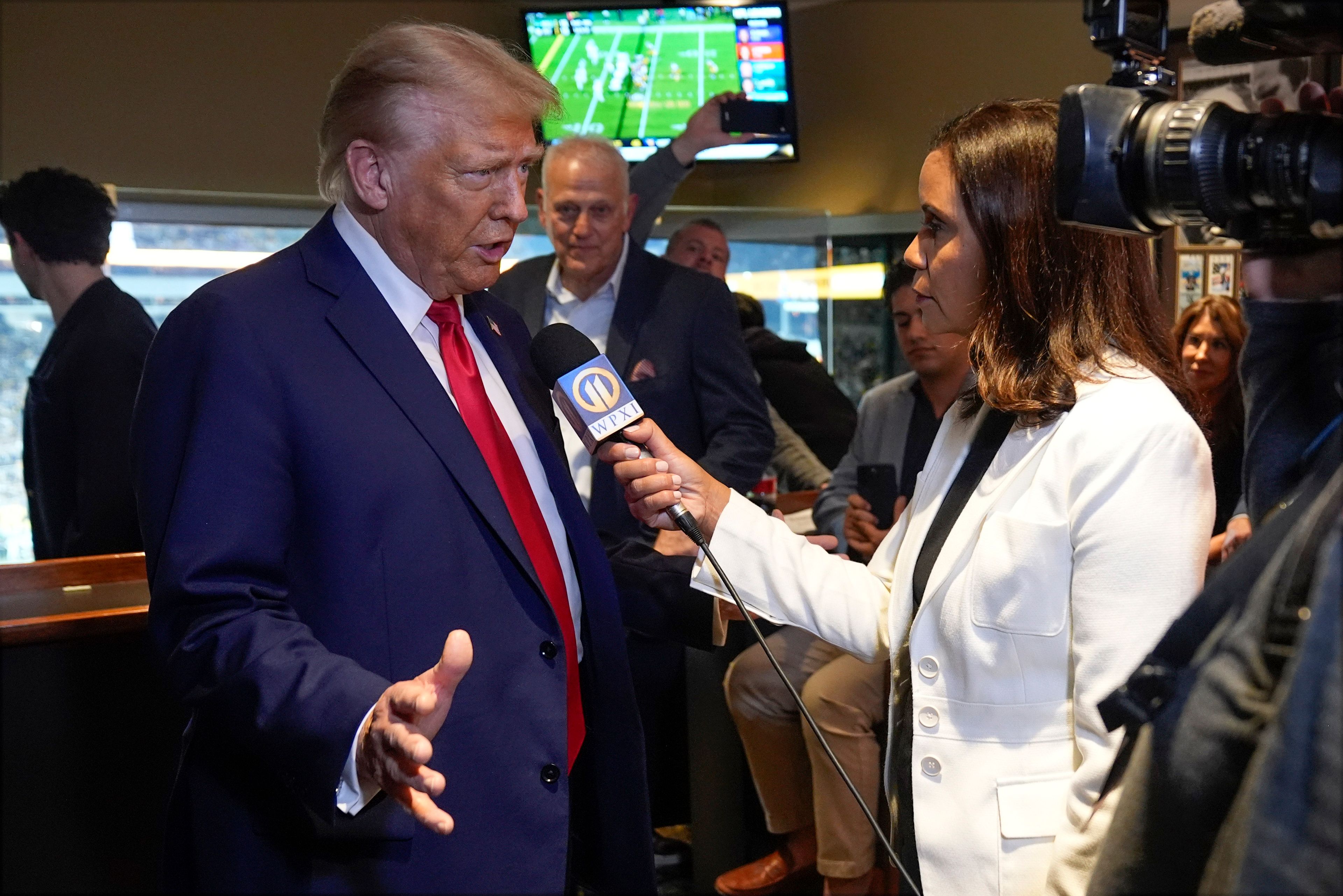 Republican presidential nominee former President Donald Trump talks during a interview as he attends the New York Jets football game against the Pittsburgh Steelers at Acrisure Stadium, Sunday, Oct. 20, 2024, in Pittsburgh. (AP Photo/Evan Vucci)