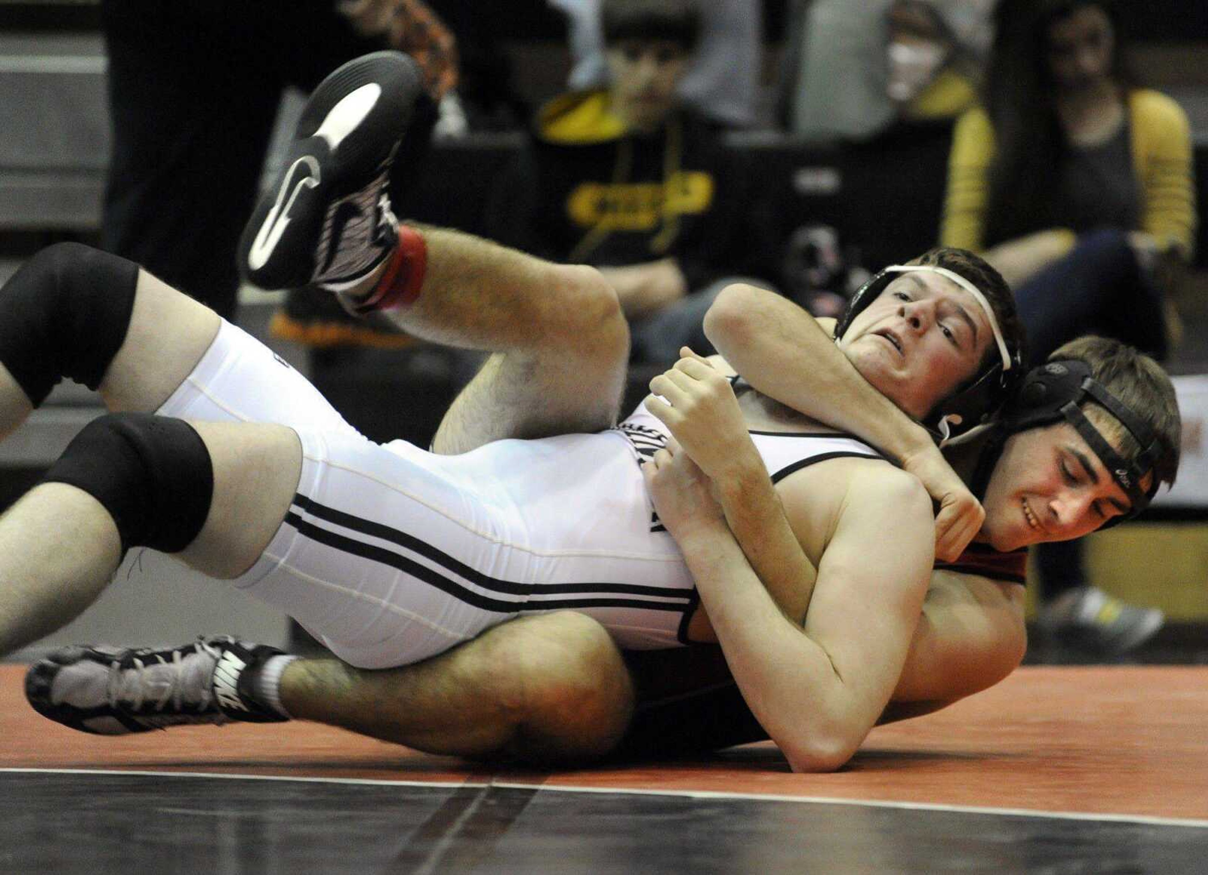 NOW: Ben Rushin takes down Farmington&#8217;s Austin Dussold in the 195-pound championship match of the SEMO Conference tournament in January. (Fred Lynch)