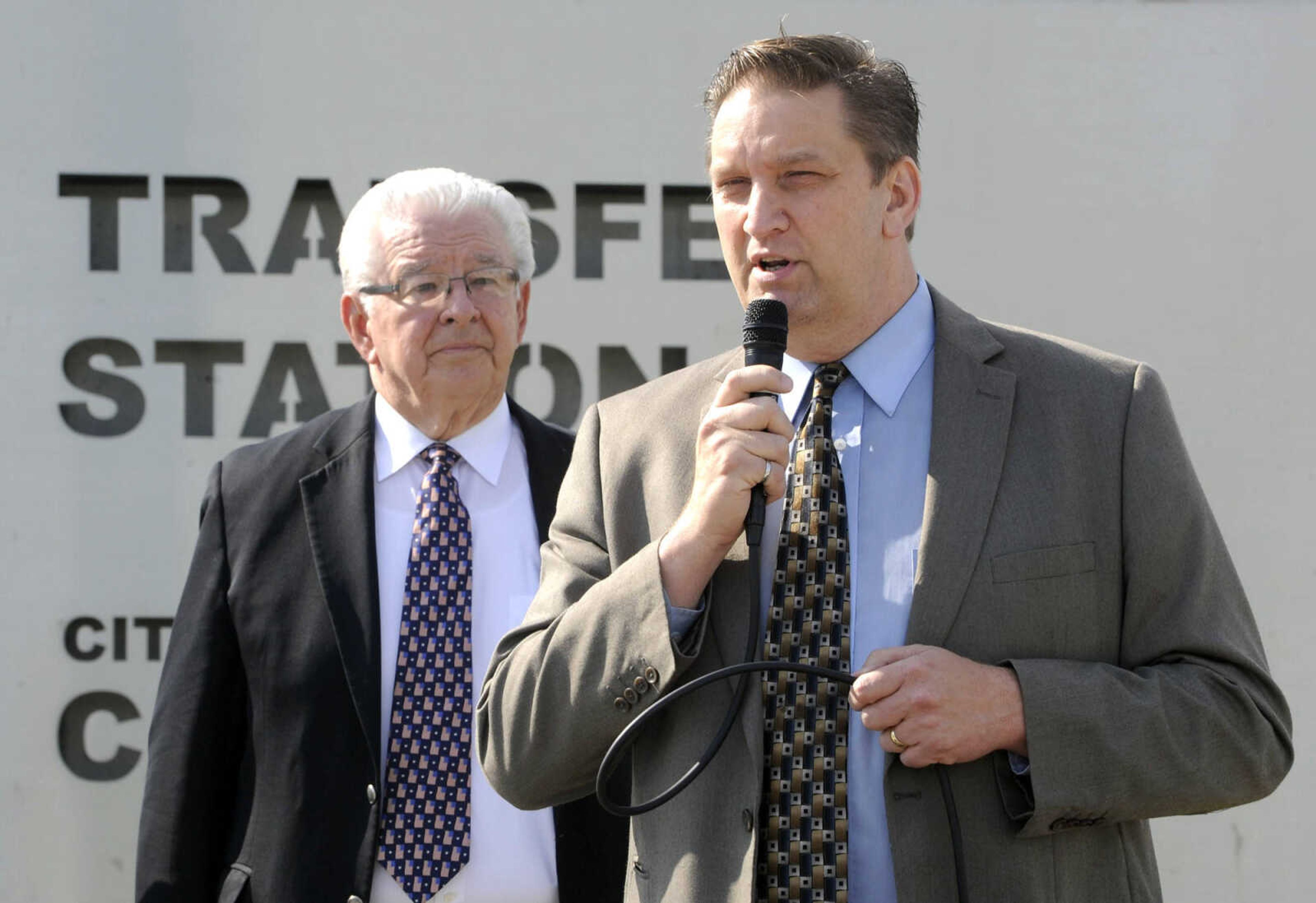 City manager Scott Meyer speaks as Mayor Harry Rediger listens at the dedication of the new solid-waste transfer station Monday, May 23, 2016 in Cape Girardeau.