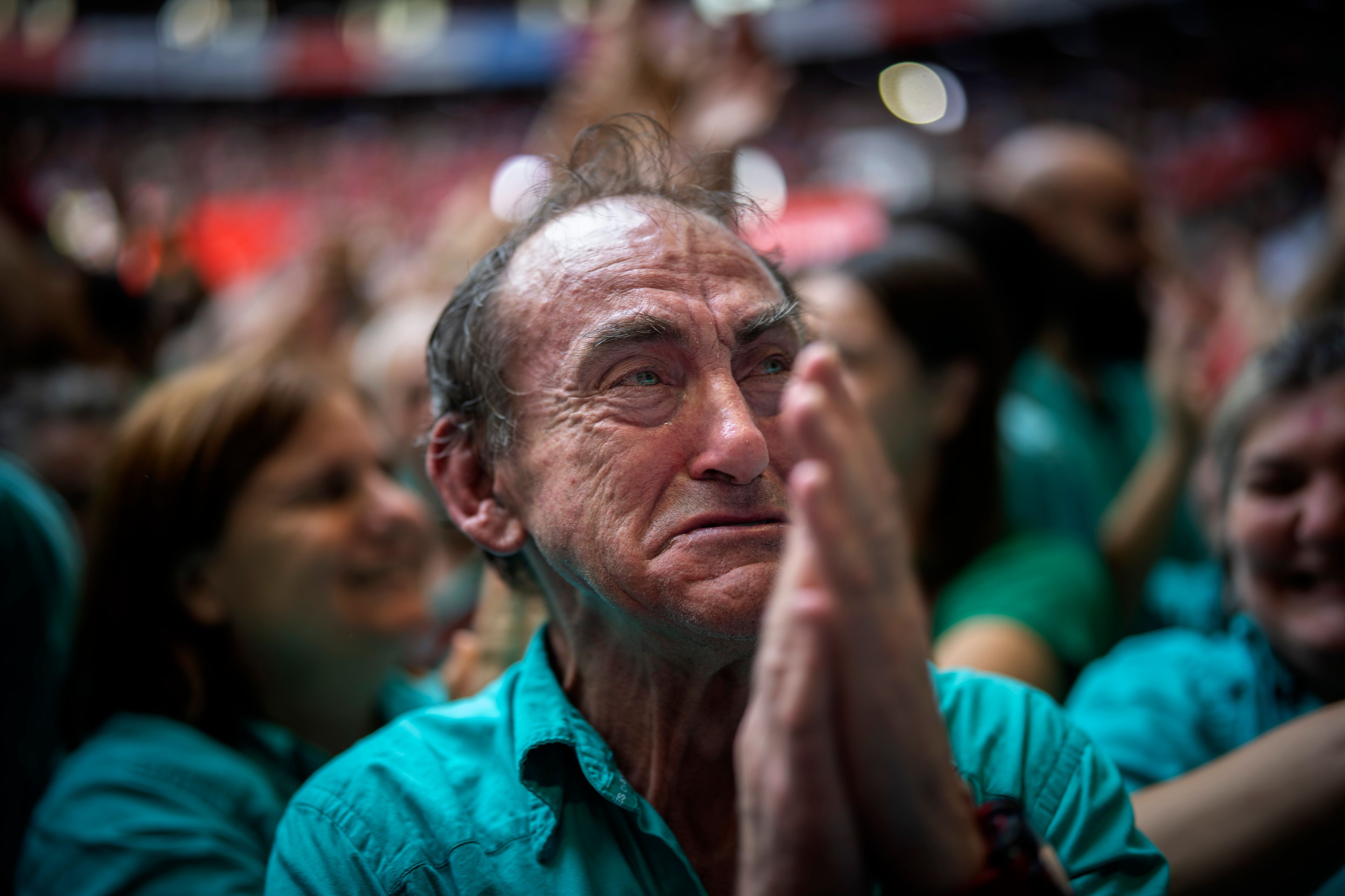 Juan Antonio Rodriguez, 72, reacts after performing next to members of "Castellers de Vilafranca" completing a "Castell" or human tower, during the 29th Human Tower Competition in Tarragona, Spain, Sunday, Oct. 6, 2024. (AP Photo/Emilio Morenatti)