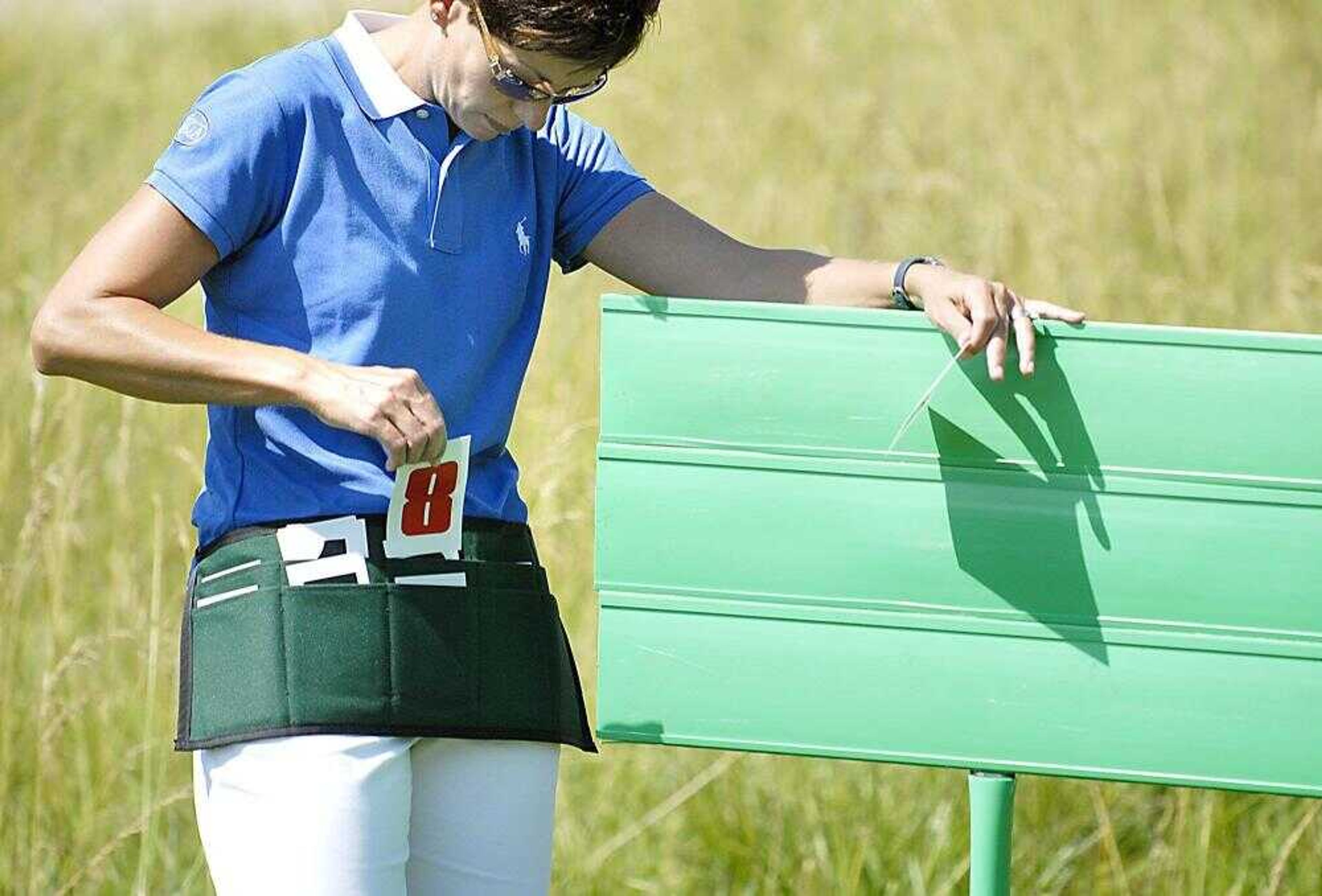 Standard bearer Jennifer Coad switches scores during the AJGA Dalhousie Junior Classic on Thursday, June 21, 2007. (Kit Doyle)