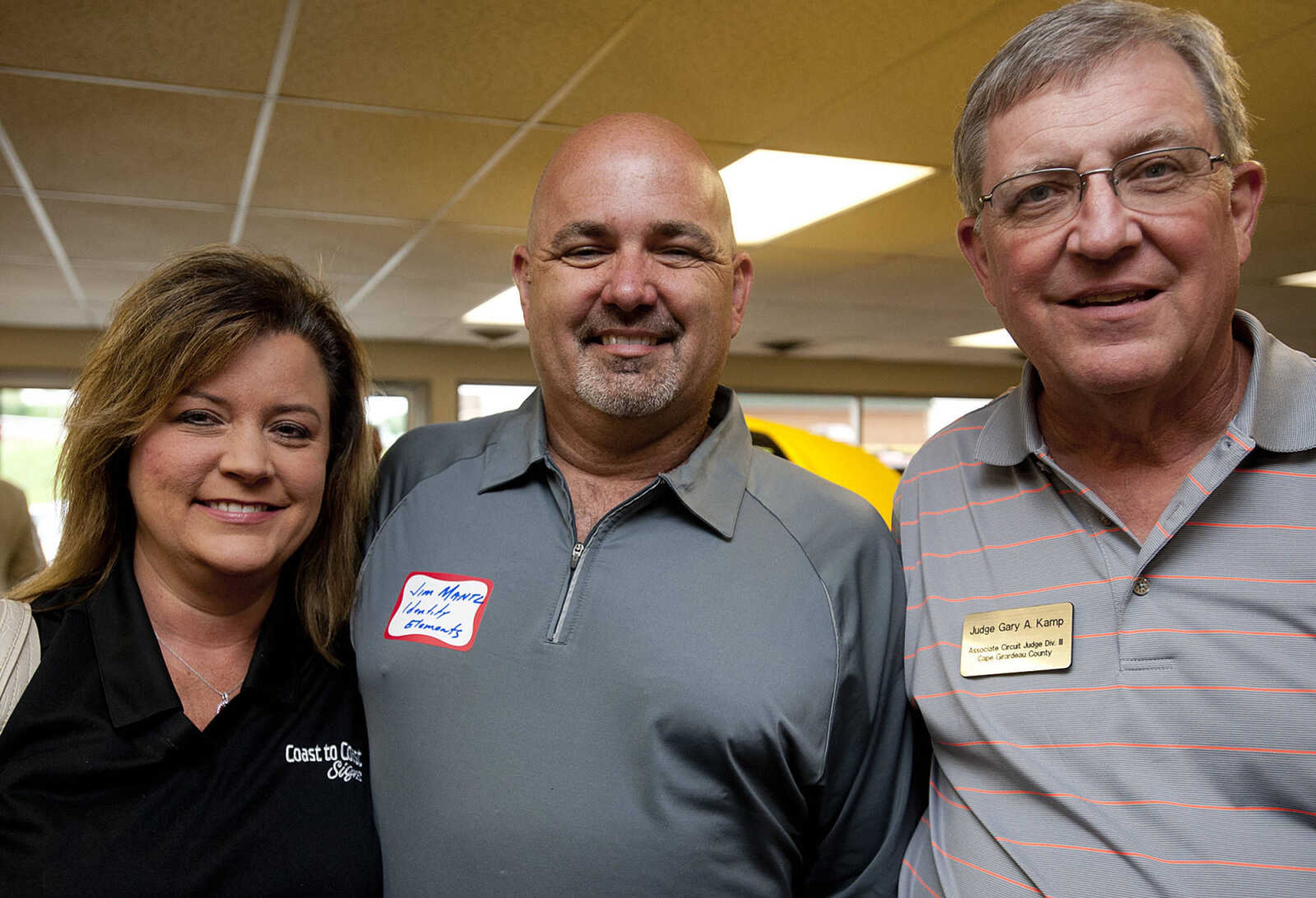 Julie Platz, left, Coast to Coast Signs, Jim Mantz, Identity Elements, and Judge Gary Kamp, Associate Circuit Jusdge for Cape Girardeau County, during the Jackson Area Chamber of Commerce's After Hours event Tuesday, May 13,  at First Auto Credit in Jackson, Mo.