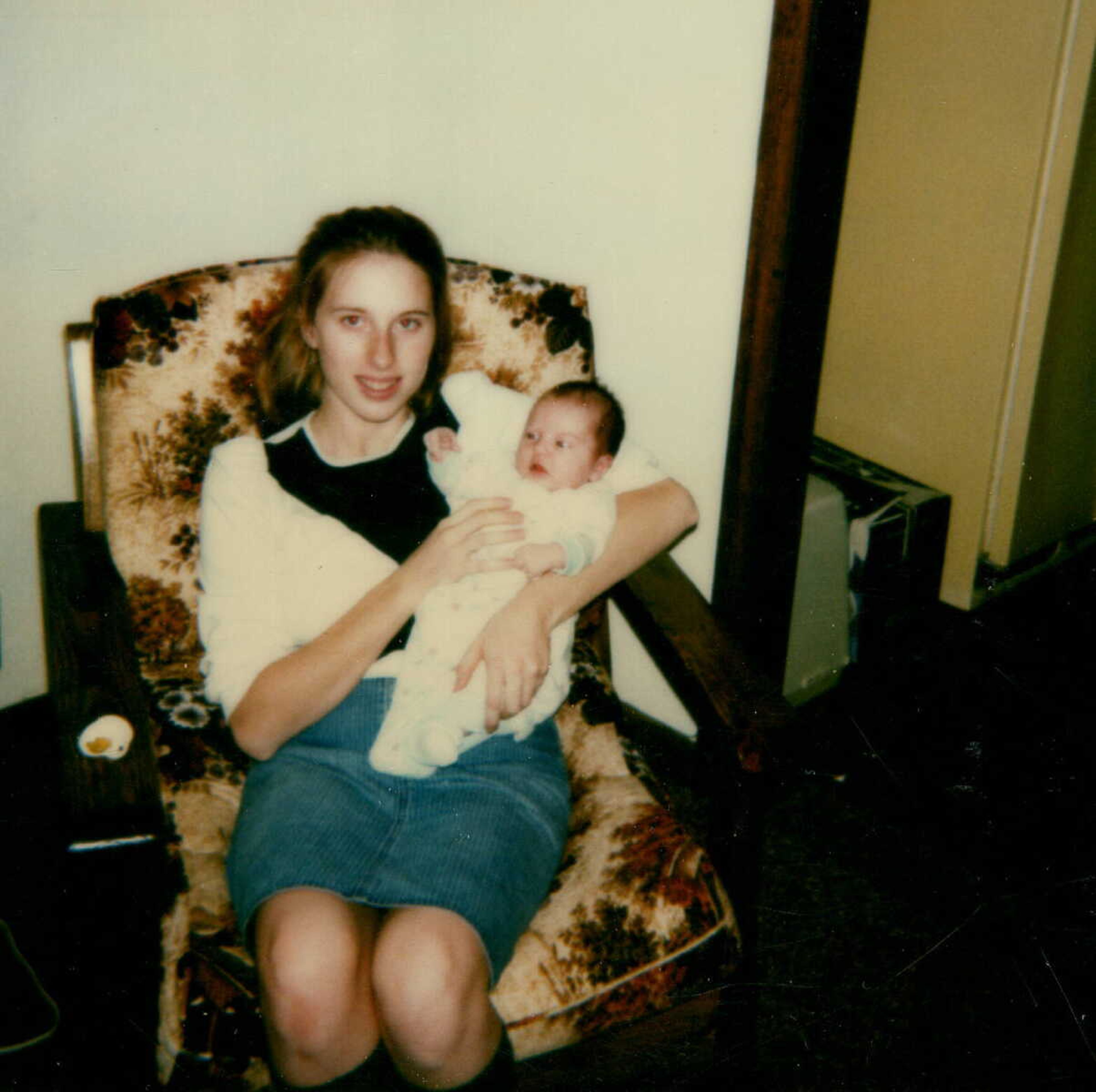 A 16-year-old Holly Thompson Rehder holds her one-week old daughter Raychel. 