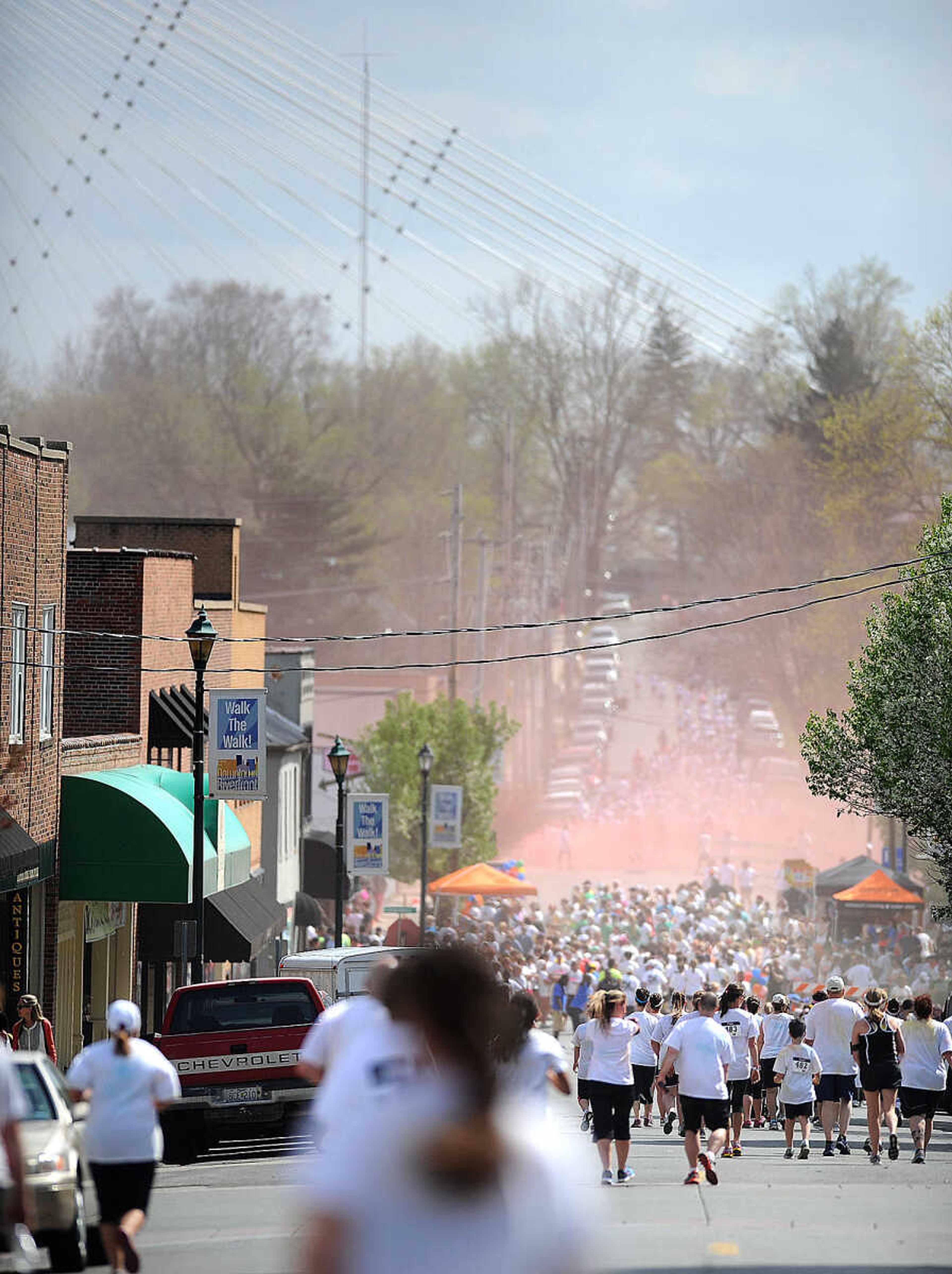 LAURA SIMON ~ lsimon@semissourian.com

Colored powder fills the air around the finish line of the Color Me Cape 5K on Spanish Street, Saturday, April 12, 2014, in Cape Girardeau.