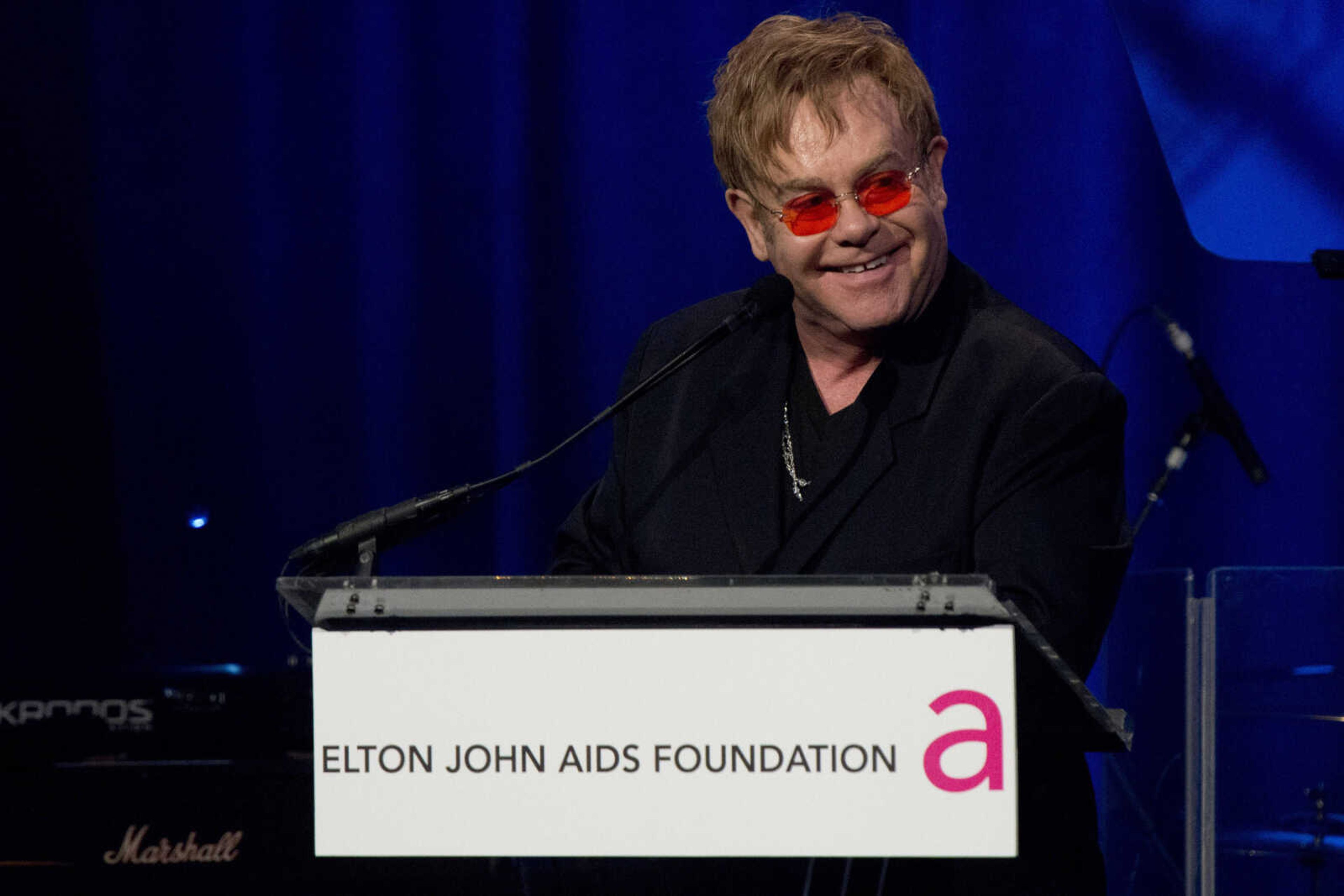 Elton John appears on stage at his AIDS Foundation's 11th annual Enduring Vision benefit on Monday, Oct. 15, 2012  in New York.  (Photo by Charles Sykes/Invision/AP)