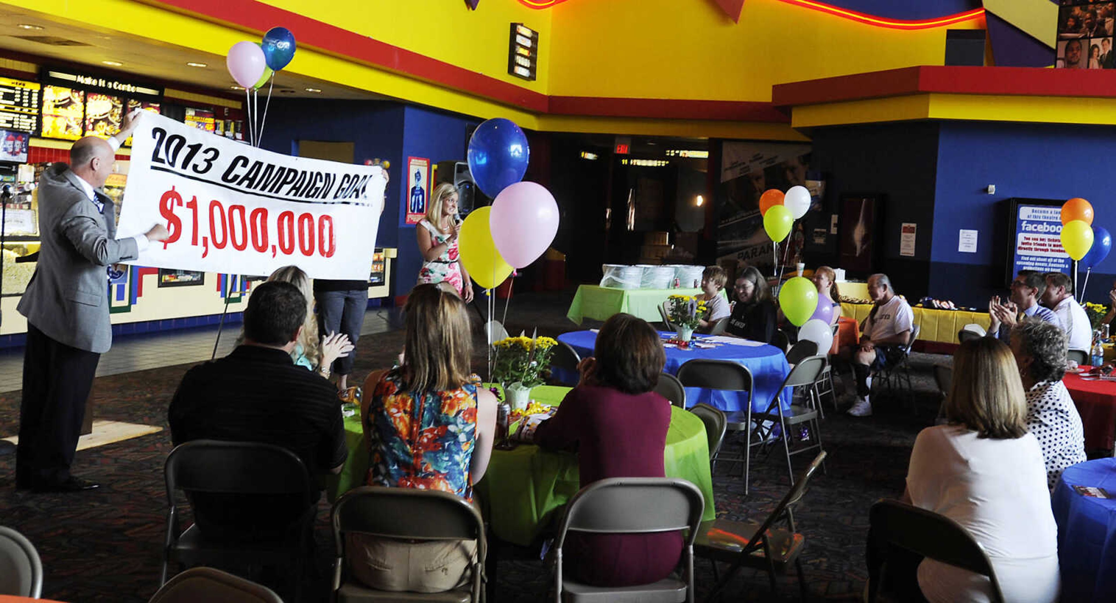 The United Way of Semo's 2013 Campaign goal is announced on a bannerduring the 2013 Campaign Kick-off Thursday, Aug. 29 at Cape West Cine in Cape Girardeau.