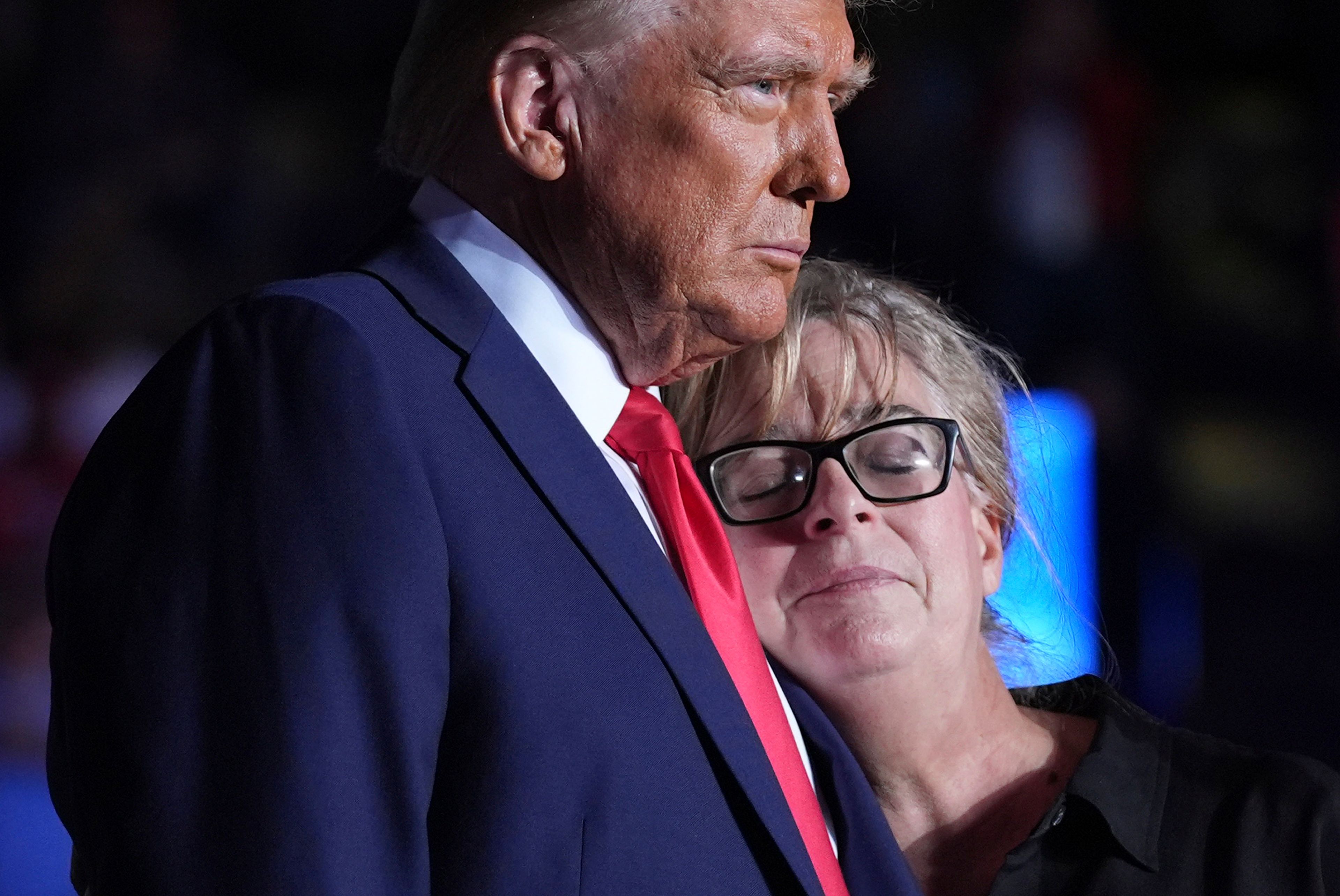 Republican presidential nominee former President Donald Trump embraces Patty Morin, mother of Rachel Morin, during a campaign rally at Santander Arena, Monday, Nov. 4, 2024, in Reading, Pa. (AP Photo/Evan Vucci)