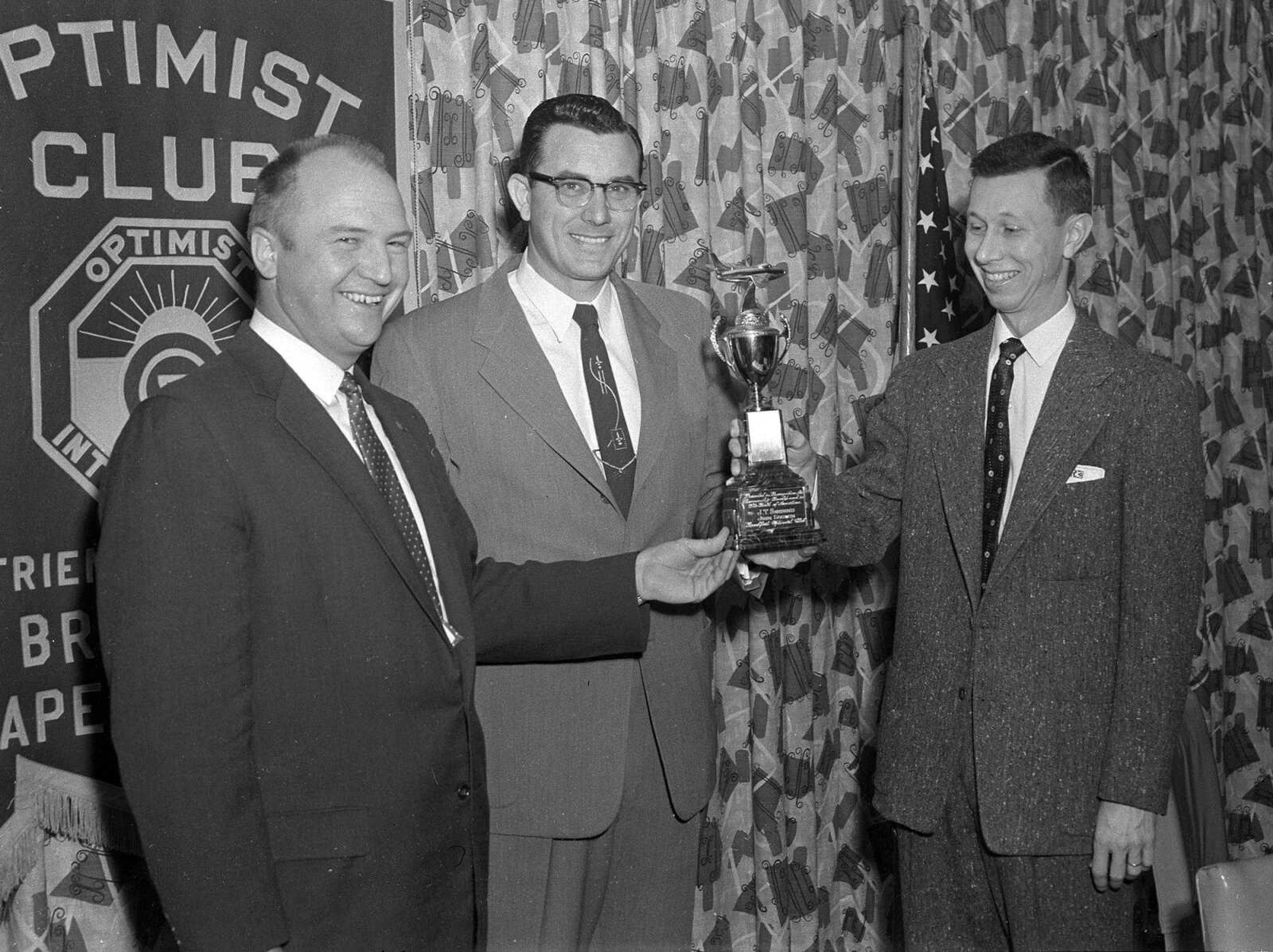 Southeast Missourian archive
The first annual Past President's Award, given by the Breakfast Optimist Club, was presented Jan. 13, 1958 to John T. Seesing, left, and John E. Godwin, center, by J.J. Russell, immediate past president of the Breakfast Optimist Club of Cape Girardeau. The men were recognized for their efforts on behalf of aviation as an important phase of community development. They operate Cape Central Airways.