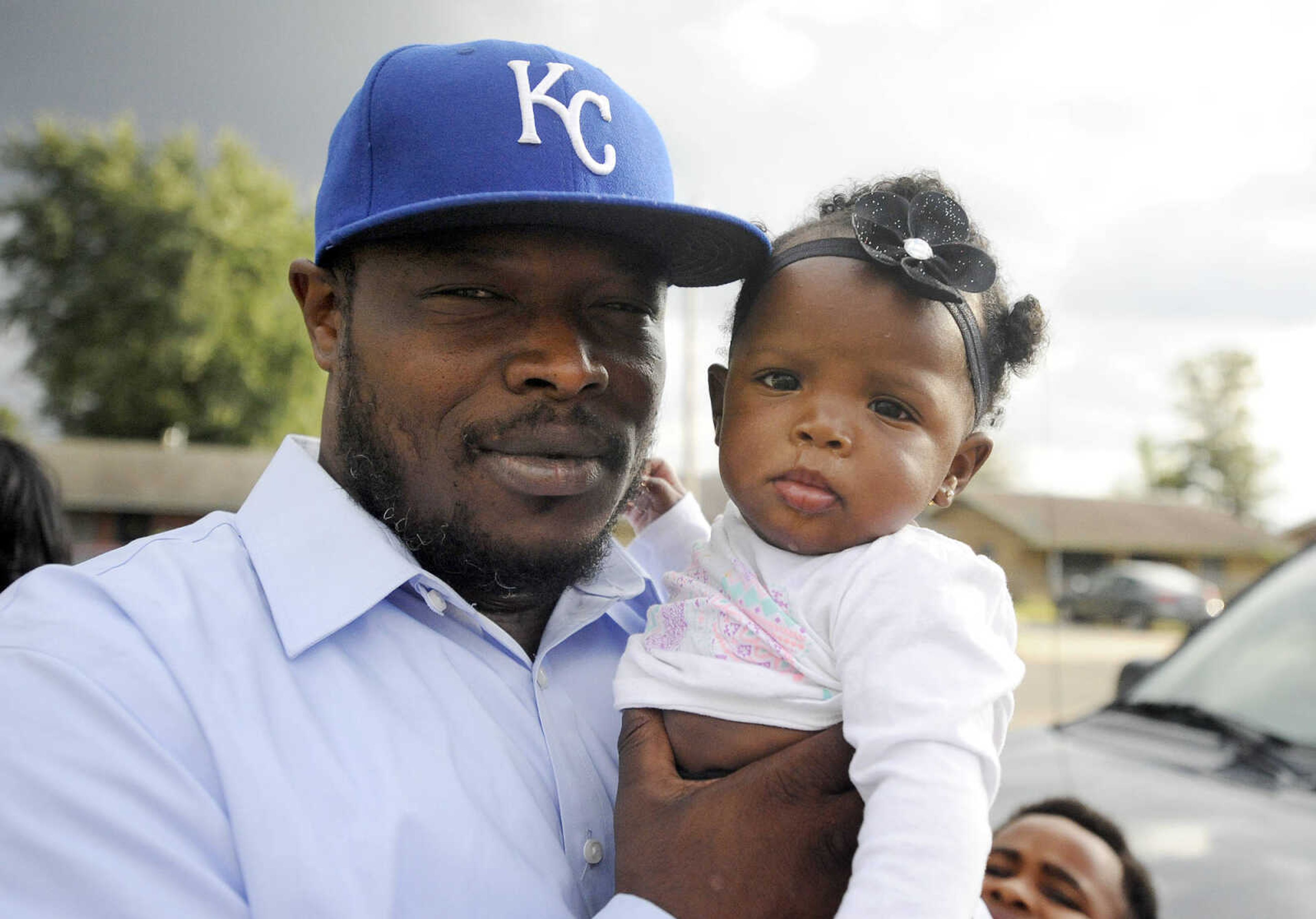 LAURA SIMON ~ lsimon@semissourian.com

Justin Robinson holds then seventh-month-old Justice, outside his mother's Sikeston, Missouri home in September.