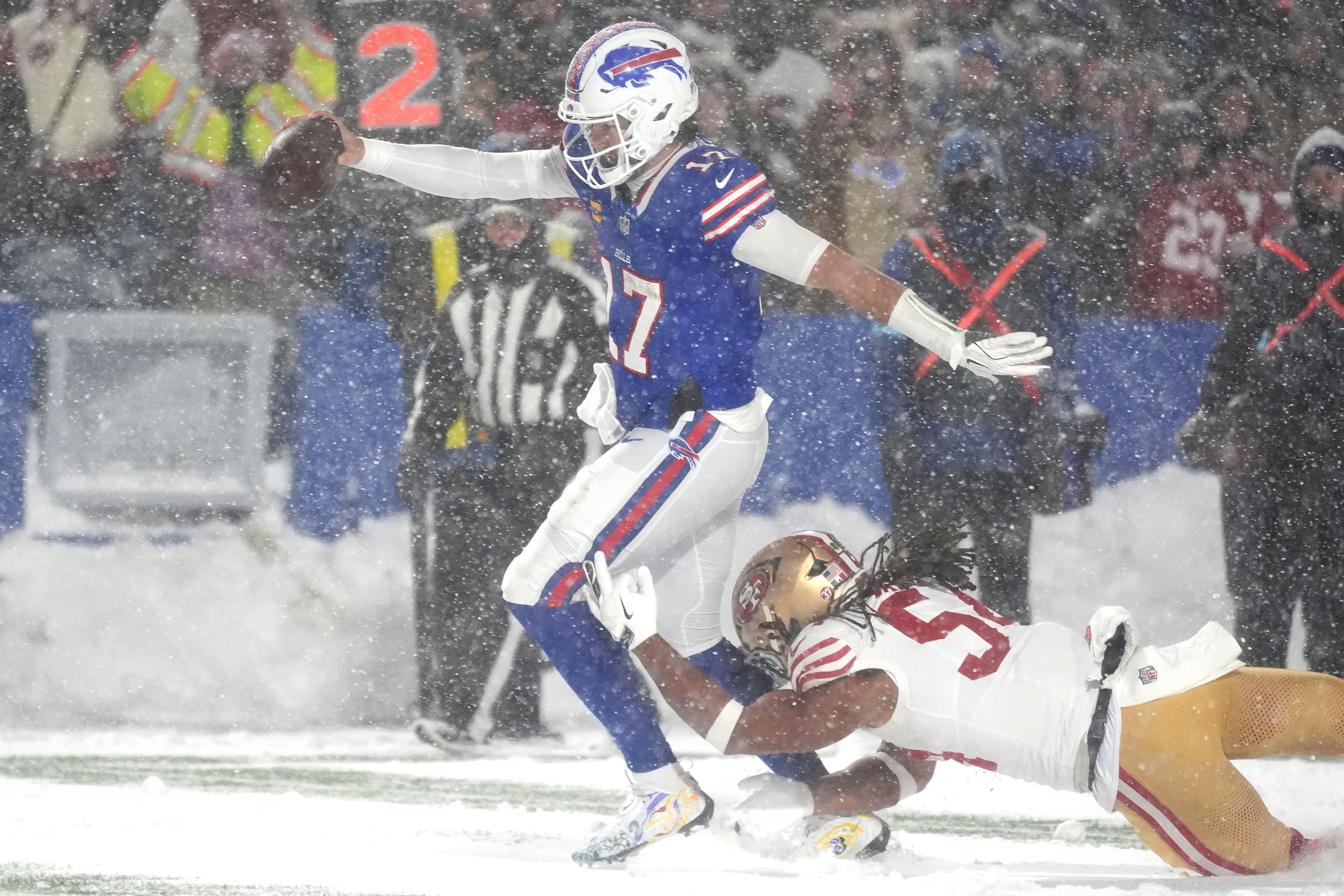 Buffalo Bills quarterback Josh Allen, middle, scores past San Francisco 49ers linebacker Fred Warner during the second half of an NFL football game in Orchard Park, N.Y., Sunday, Dec. 1, 2024. (AP Photo/Gene J. Puskar)