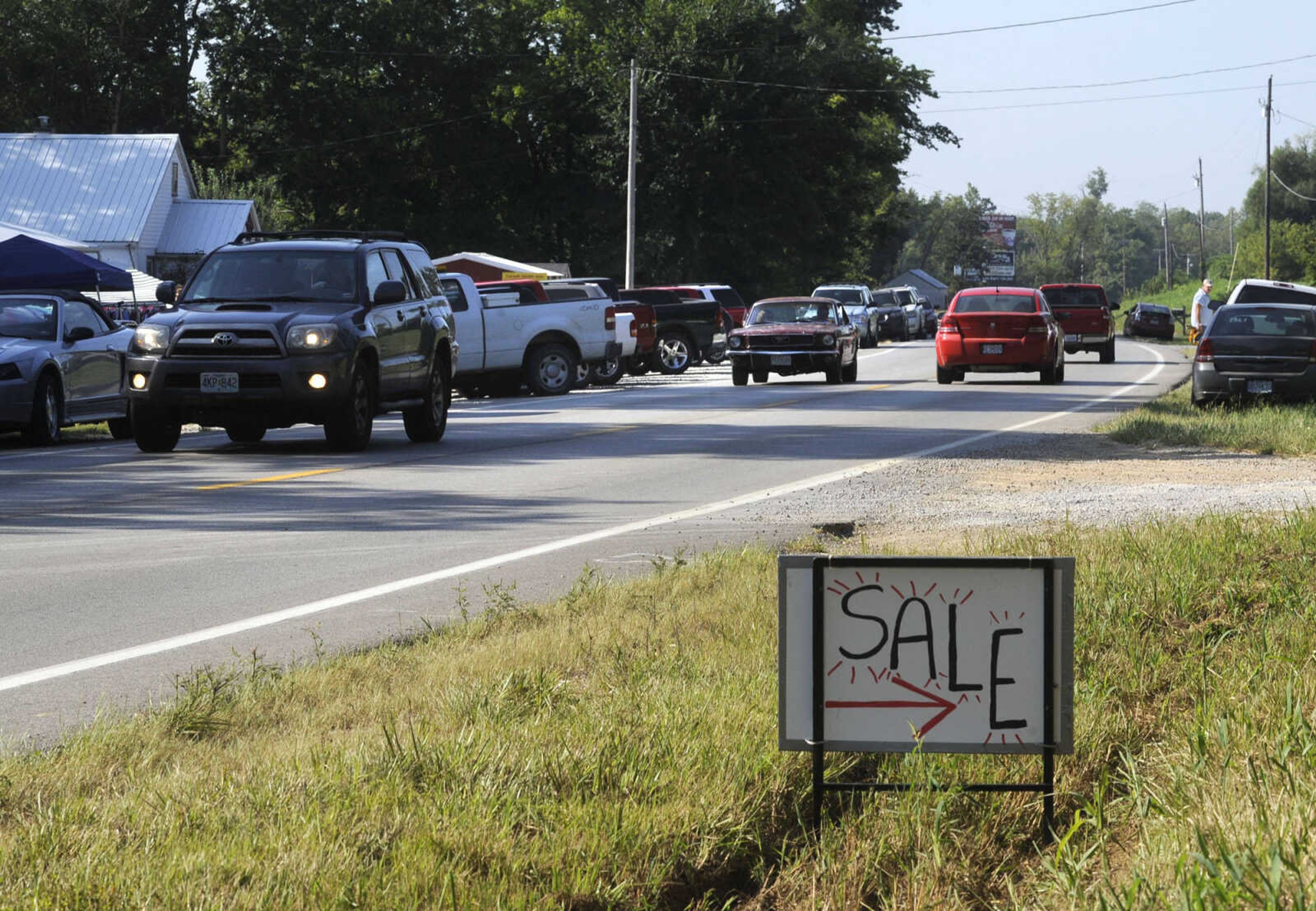 Traffic slows as motorists stop to shop during the Highway 61 Yard Sale Saturday, Aug. 31, 2013 in Jackson.