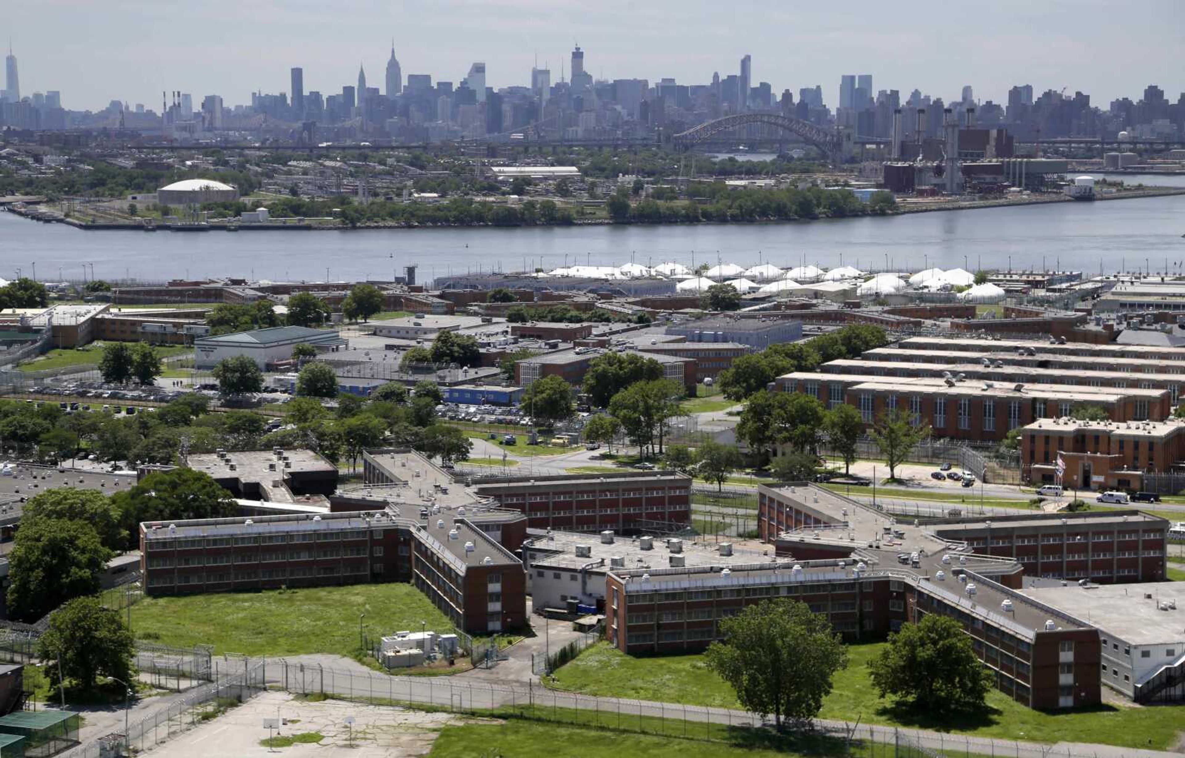 The Rikers Island jail complex June 20, 2014, in New York, with the Manhattan skyline in the background.