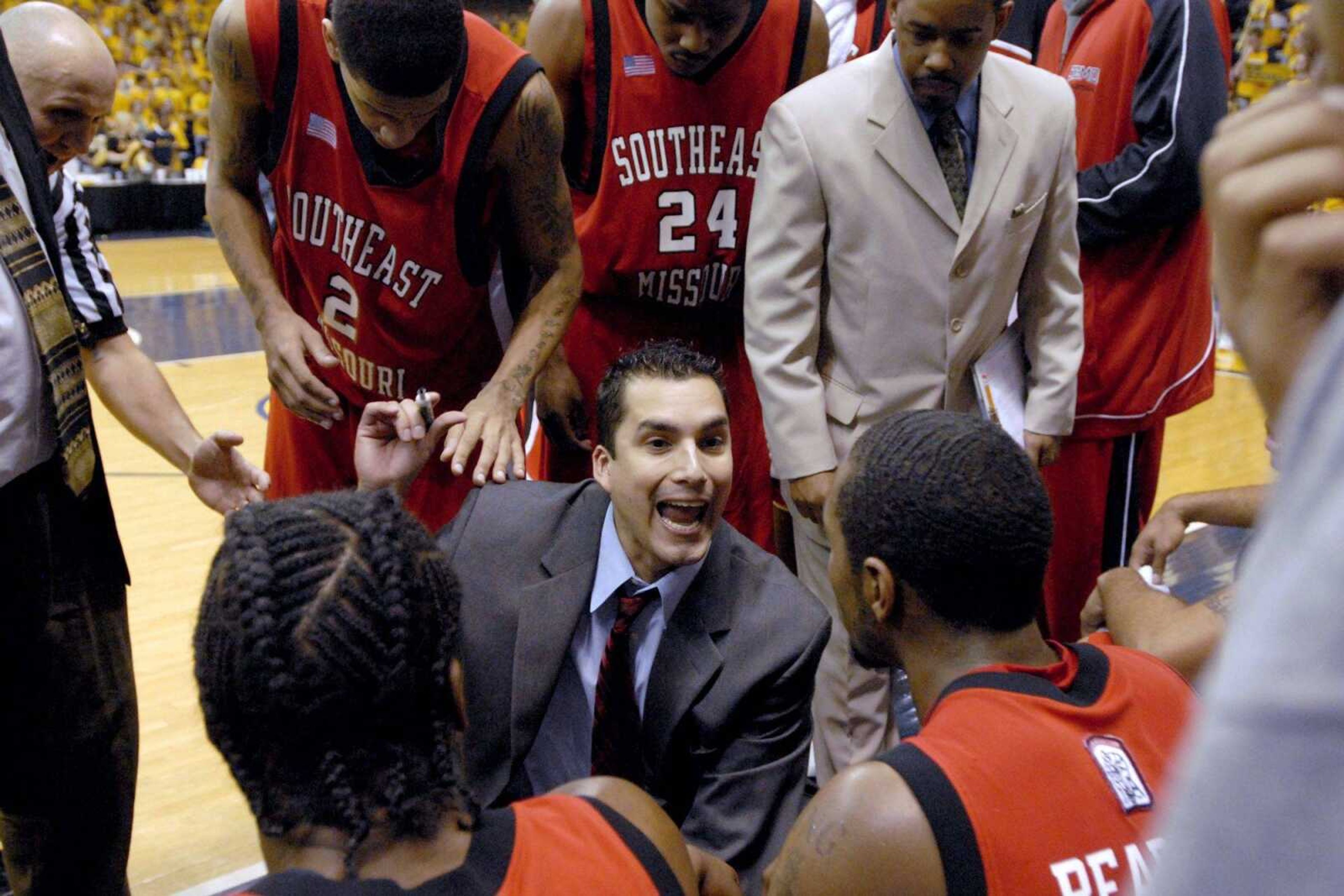 Southeast assistant coach Zac Roman, center, talked to players during a timeout while serving as interim coach. (Aaron Eisennhauer ~ Southeast Missourian)