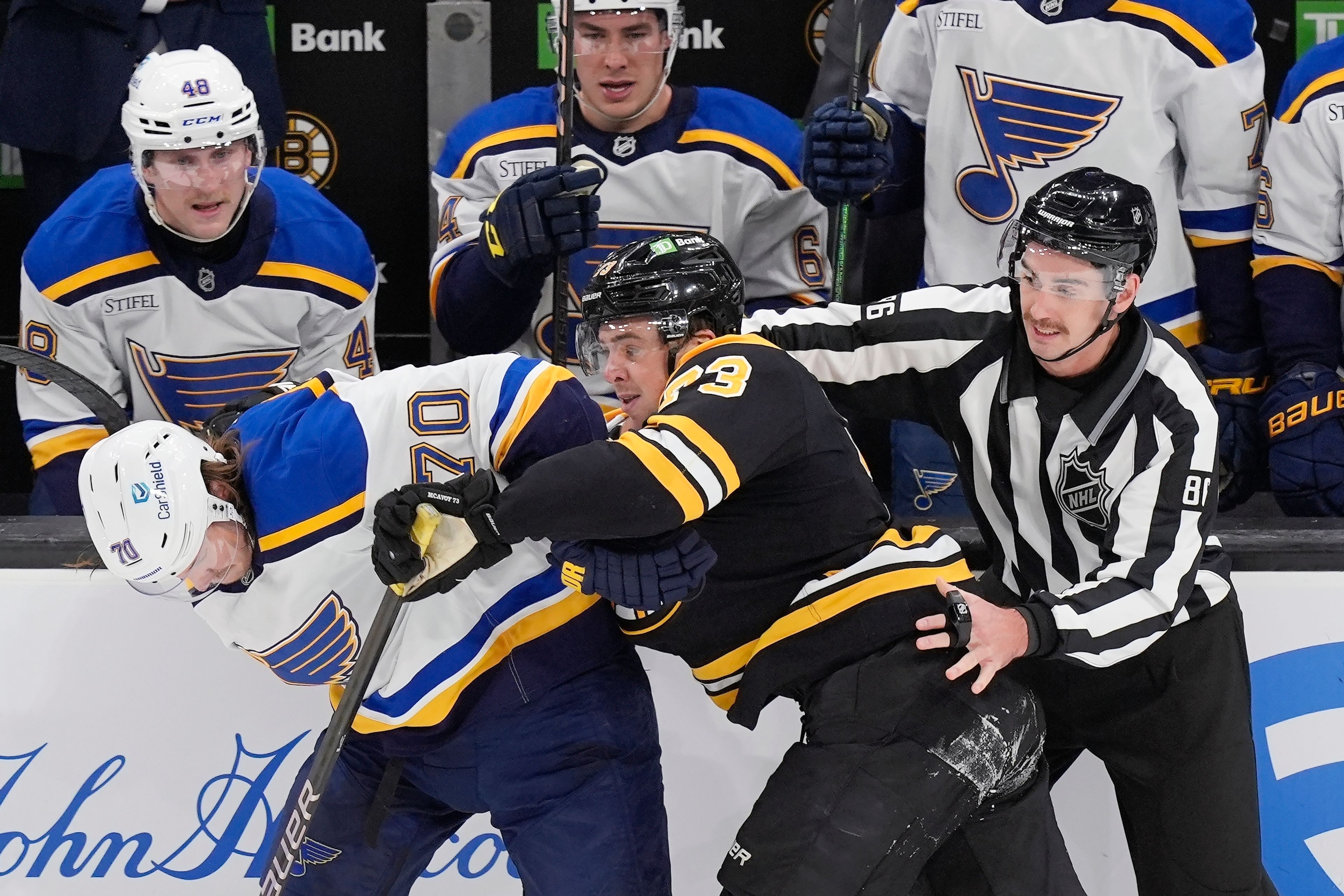 Boston Bruins' Charlie McAvoy (73) commits a rouging penalty on St. Louis Blues' Oskar Sundqvist (70) during the second period of an NHL hockey game, Saturday, Nov. 16, 2024, in Boston. (AP Photo/Michael Dwyer)