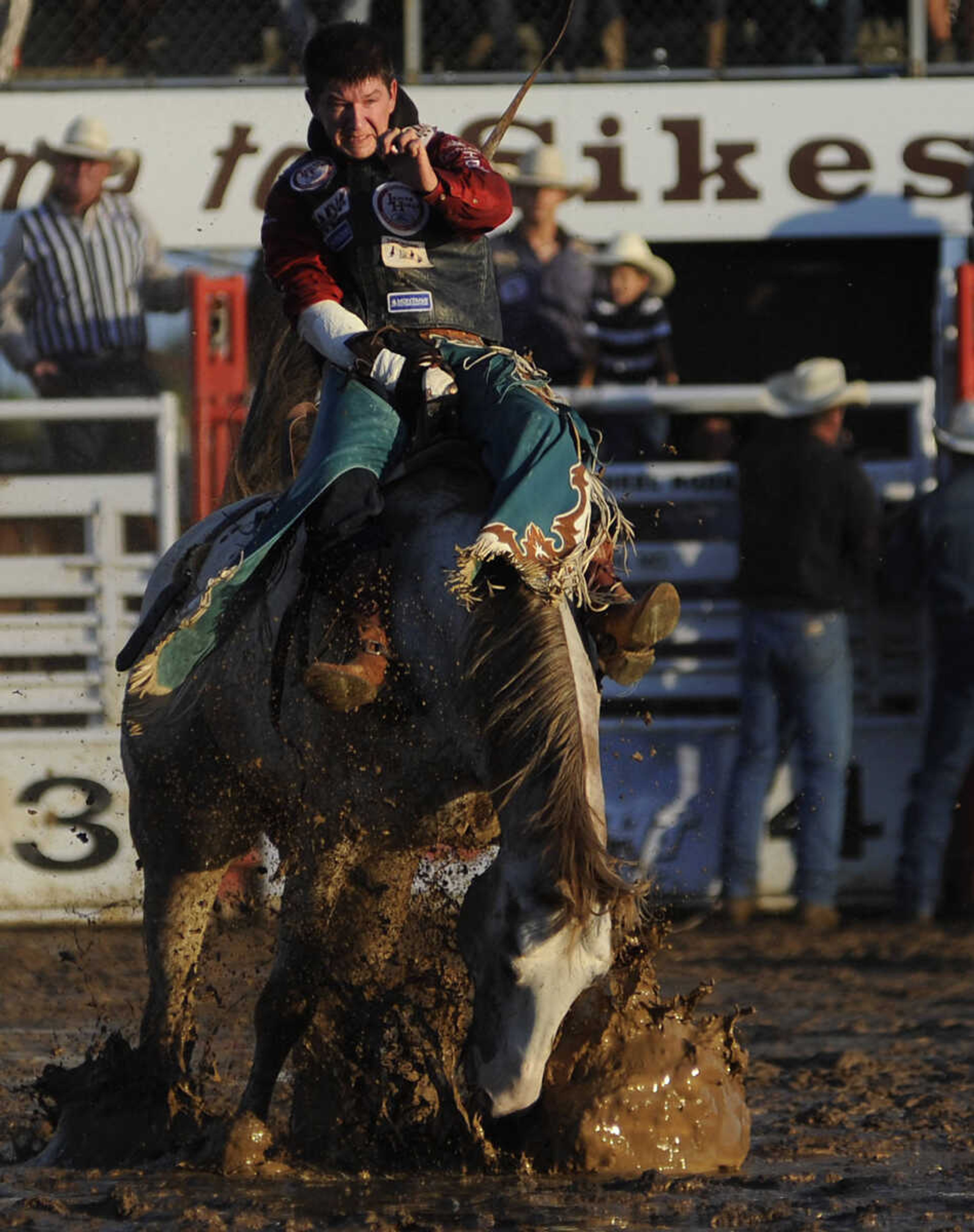 ADAM VOGLER ~ avogler@semissourian.com
Justin McDaniel rides Smart Water in the bareback riding competition at the Sikeston Jaycee Bootheel Rodeo Wednesday, August 7, in Sikeston, Mo. McDaniel received a score of 81 for his ride.