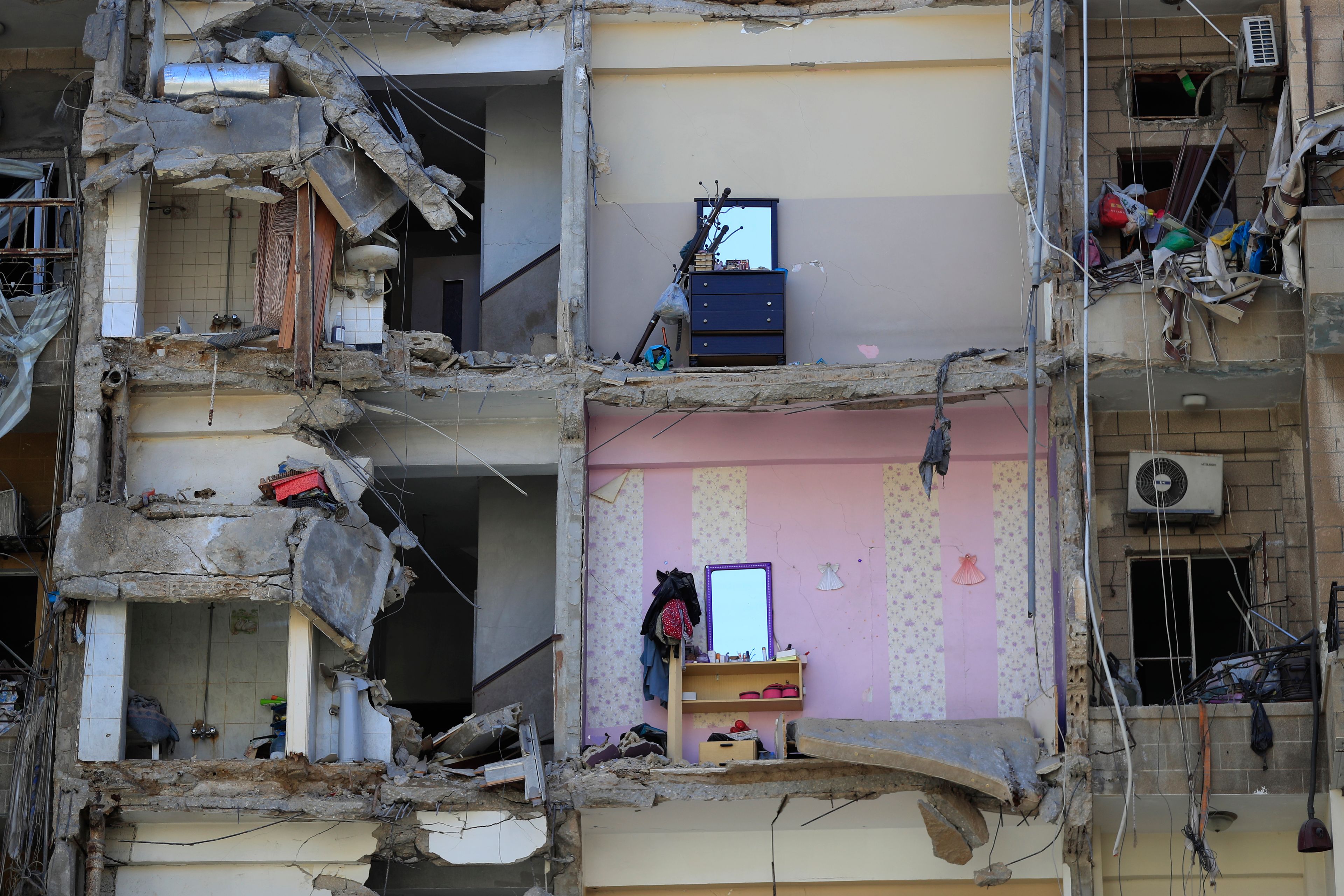 Damaged furnitures left on destroyed apartments that were hit by Israeli airstrikes, in Tyre, south Lebanon, Thursday, Oct. 24, 2024. (AP Photo/Mohammed Zaatari)