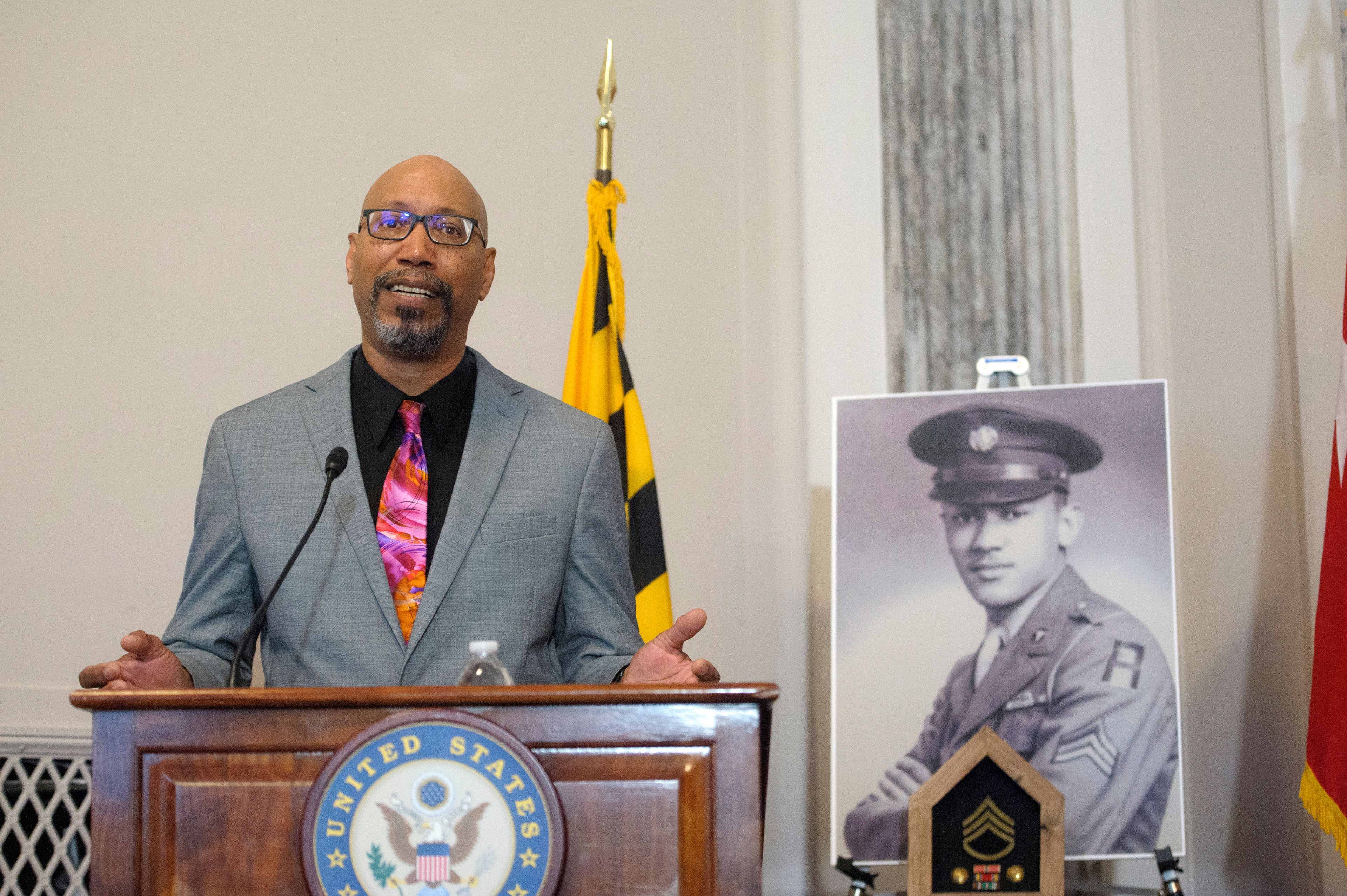 Steve Woodson offers remarks during a ceremony to posthumously award the Distinguished Service Cross to his father, U.S. Army Staff Sgt. Waverly Woodson Jr., a medic who was part of the only Black combat unit to take part in the D-Day invasion of France during World War II, on Capitol Hill, in Washington, Tuesday, Sept. 24, 2024. (AP Photo/Rod Lamkey, Jr.)