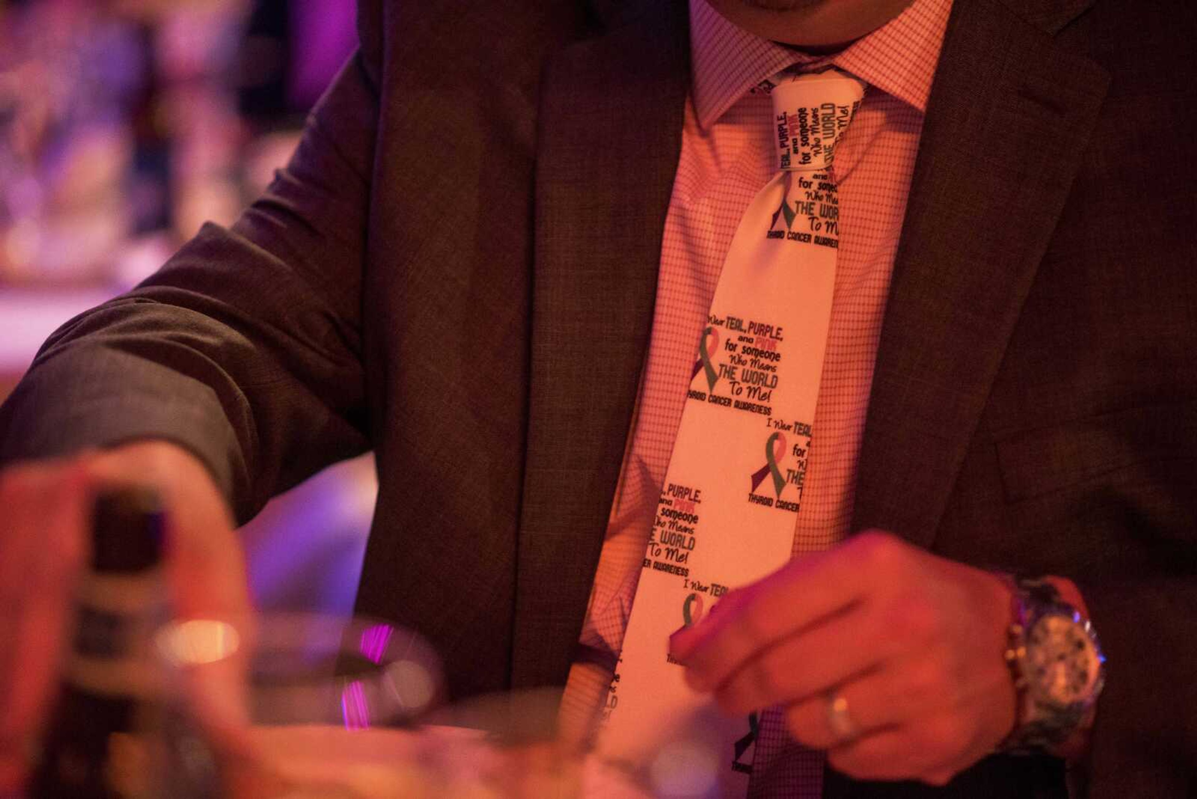 An attendee's cancer-awareness themed tie is seen during a fundraising gala for the American Cancer Society at Rusted Route Farms Saturday, Nov. 16, 2019, in Cape Girardeau.