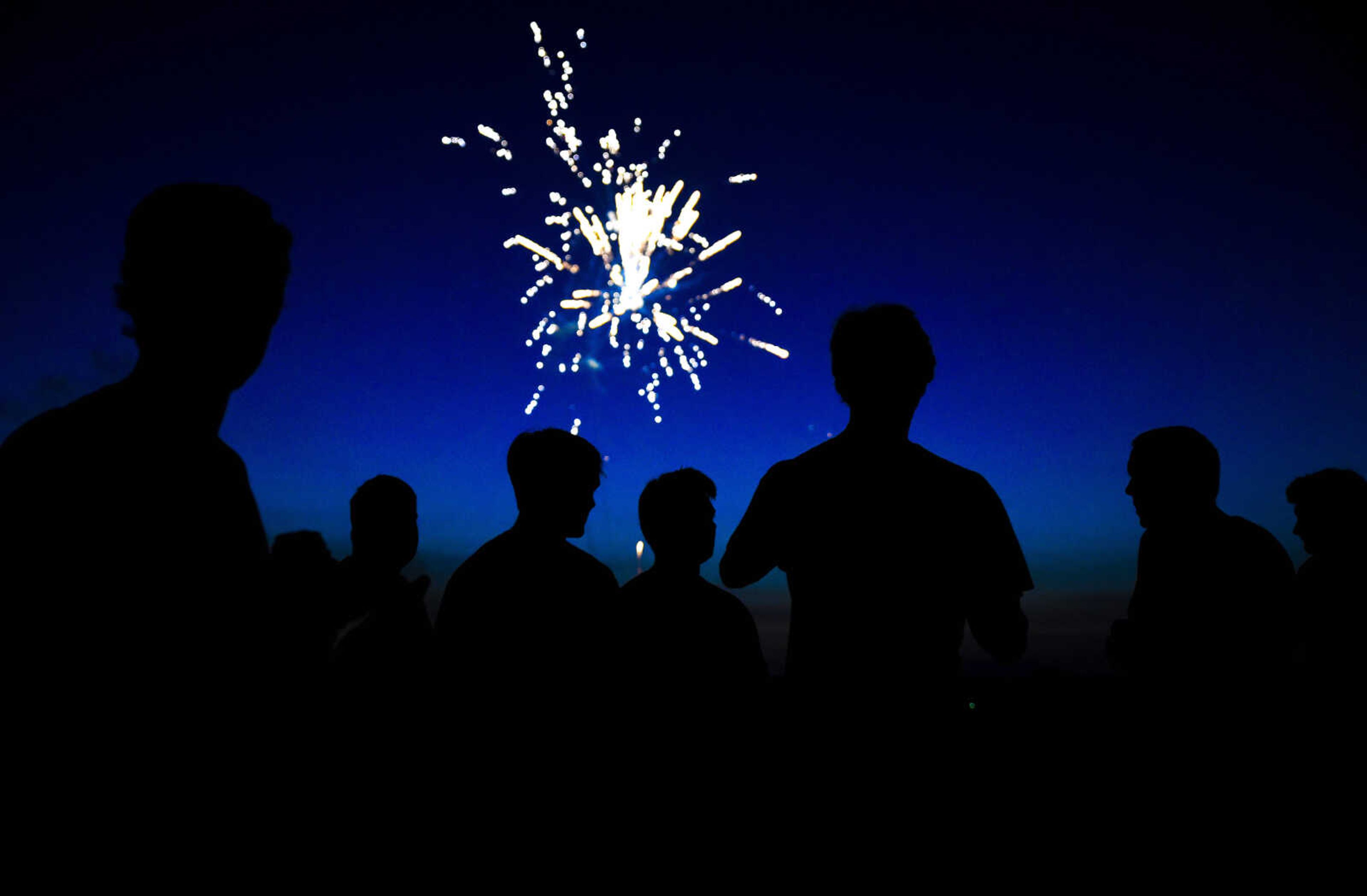 Riders watch fireworks at Sky High Motocross Park Wednesday night, July 4, 2018 after an open practice session in Old Appleton.