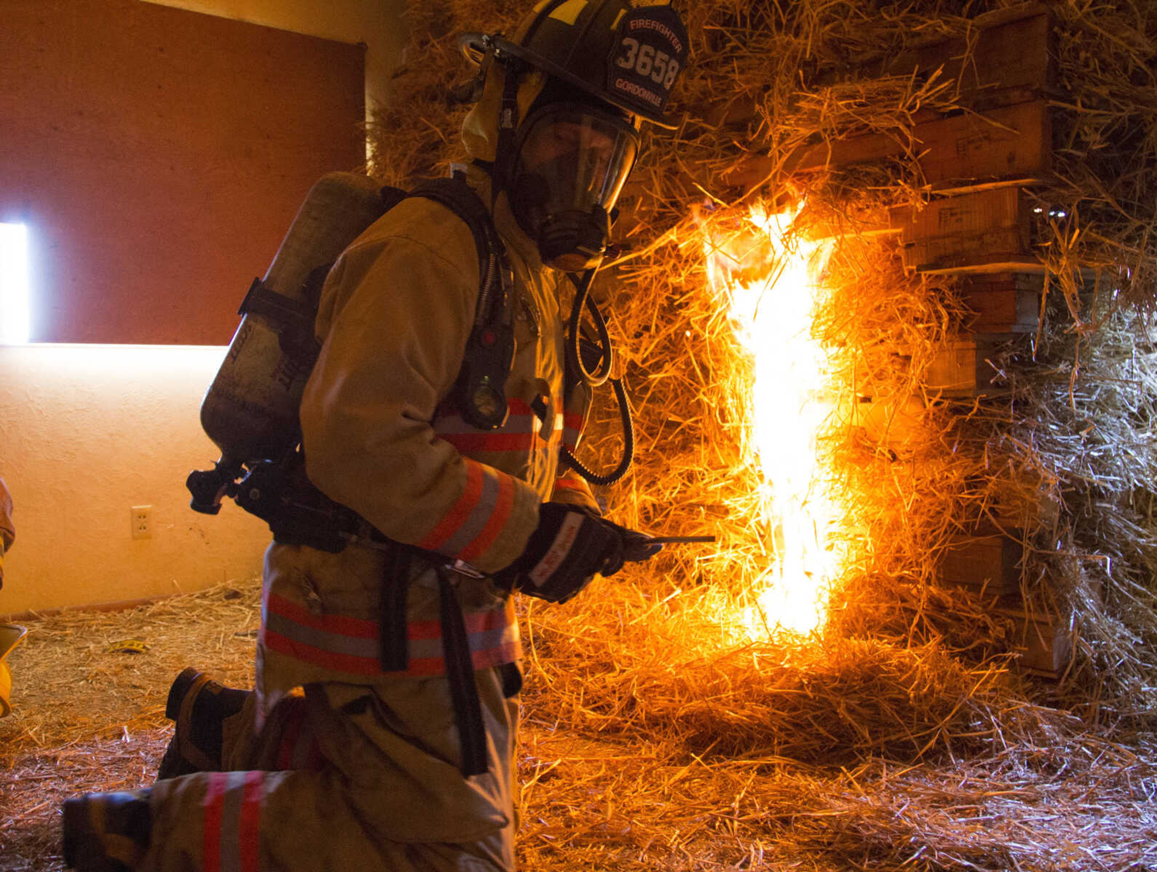 Gordonville firefighter of 33-years, Jerry Siemers ignites the fire for Saturdays live-burn training June 10, 2017 near Route K in Cape Girardeau. The structure, which was once home to Siemers' grandparents, was donated to the Cape Girardeau Fire Department for training.