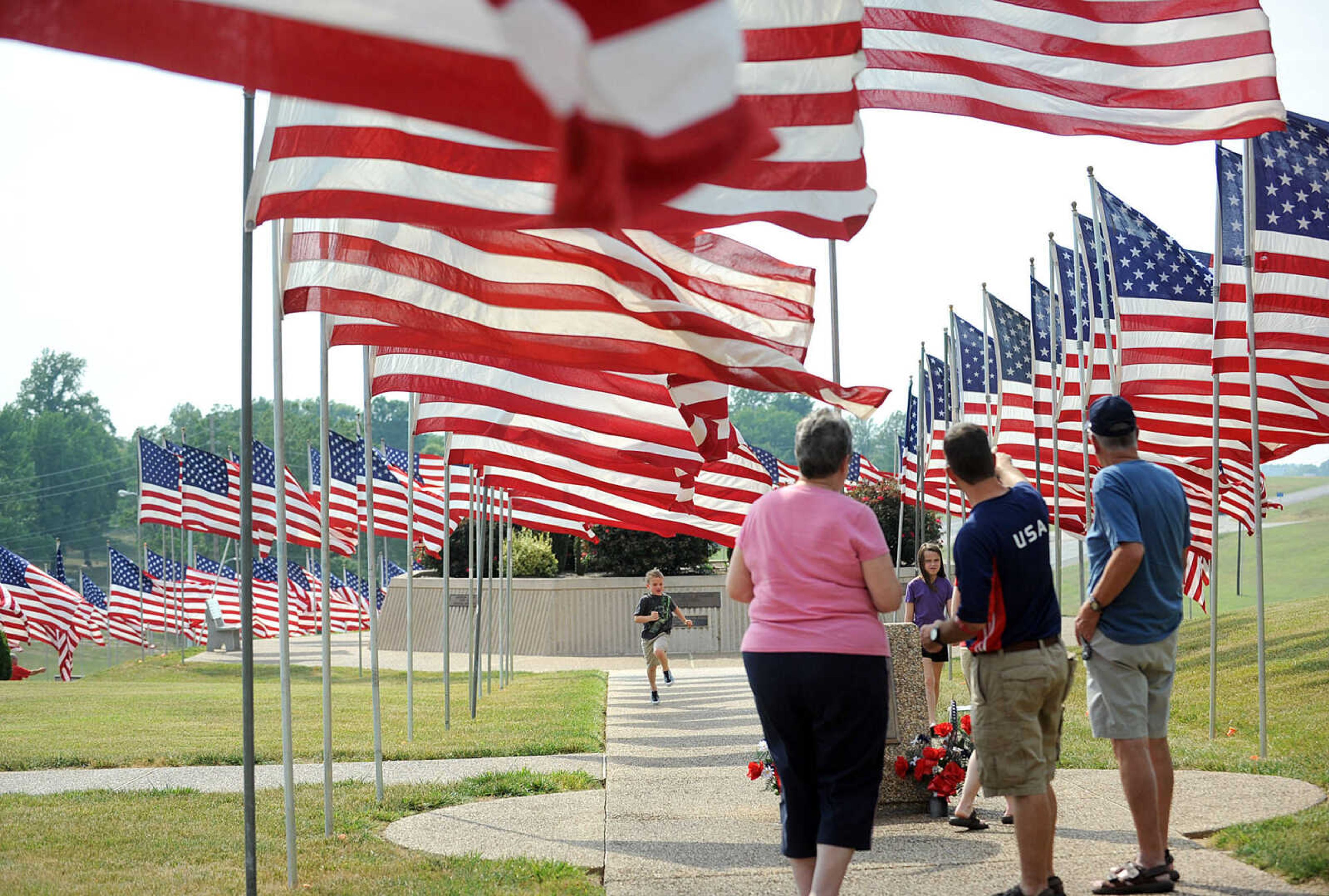 LAURA SIMON ~ lsimon@semissourian.com
People make a Memorial Day stop to the Avenue of Flags Monday, May 28, 2012 at Cape County Park North.