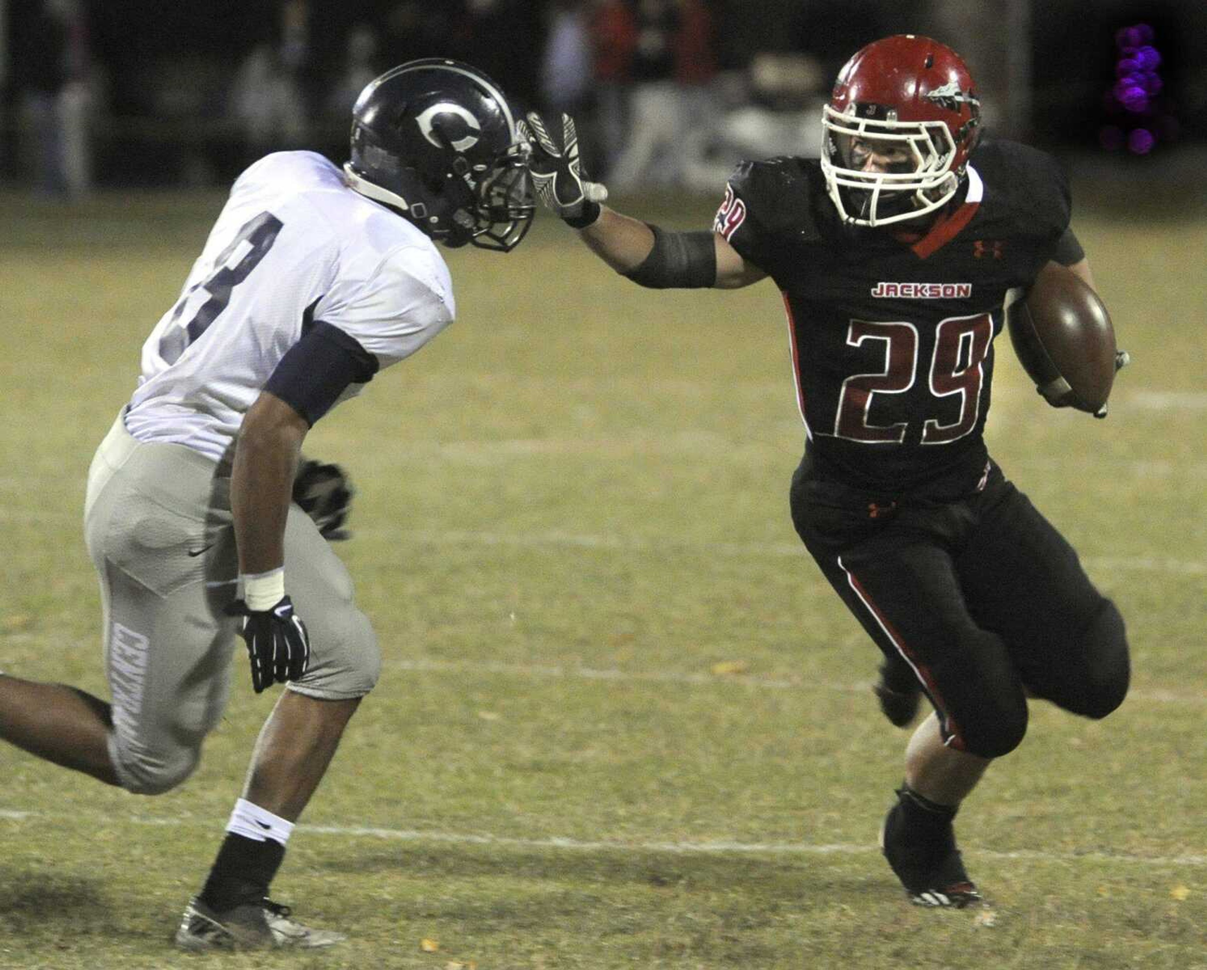 Jackson's Colten Proffer stiff-arms Francis Howell Central's Justin Allen during the first quarter Friday, Oct. 19, 2012 in Jackson. (Fred Lynch)