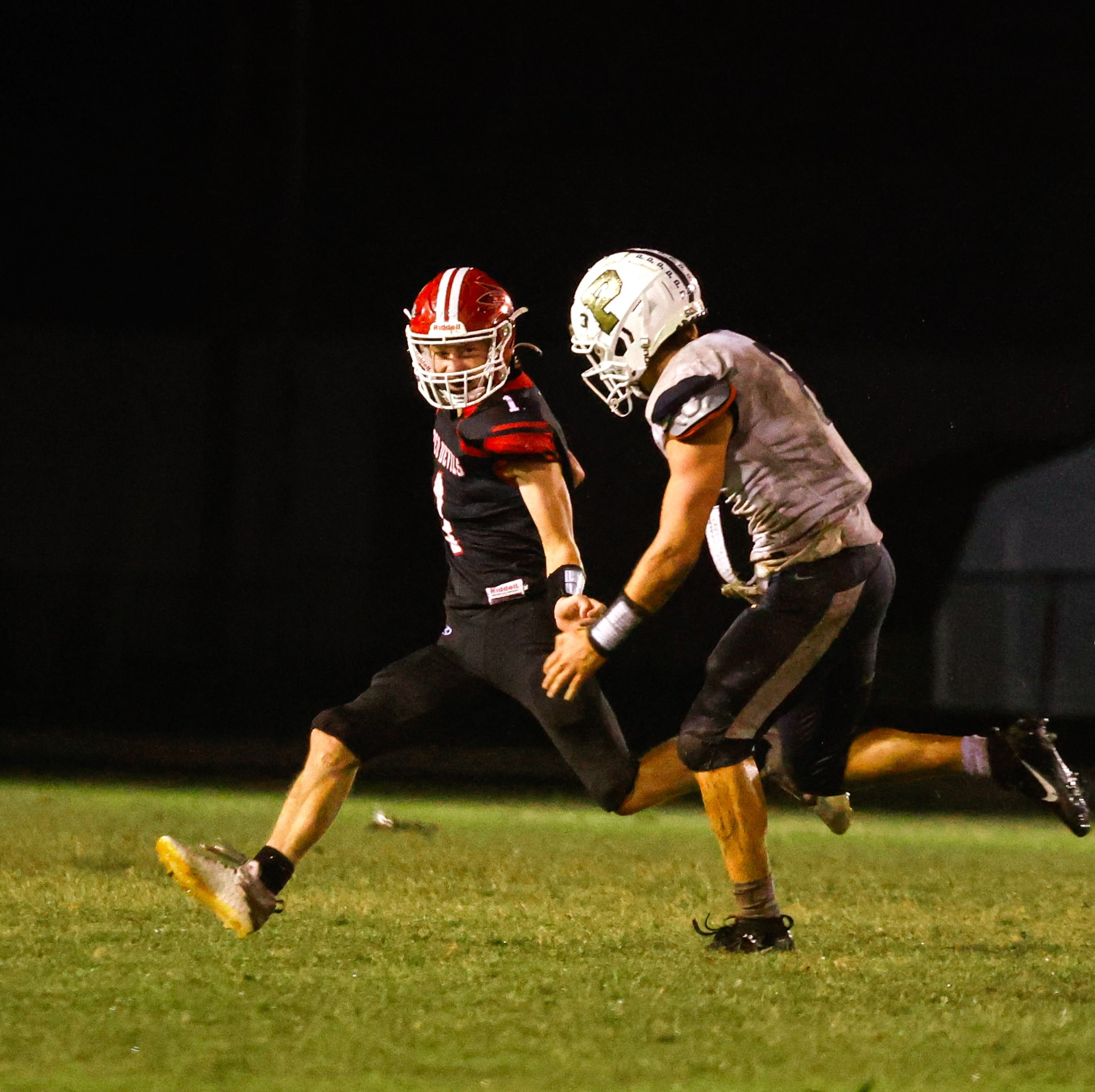 Chaffee Senior, Connor Berry, reaches out to stiff-arm the defender after a kick off return at Chaffee High School on Friday, September 27th.