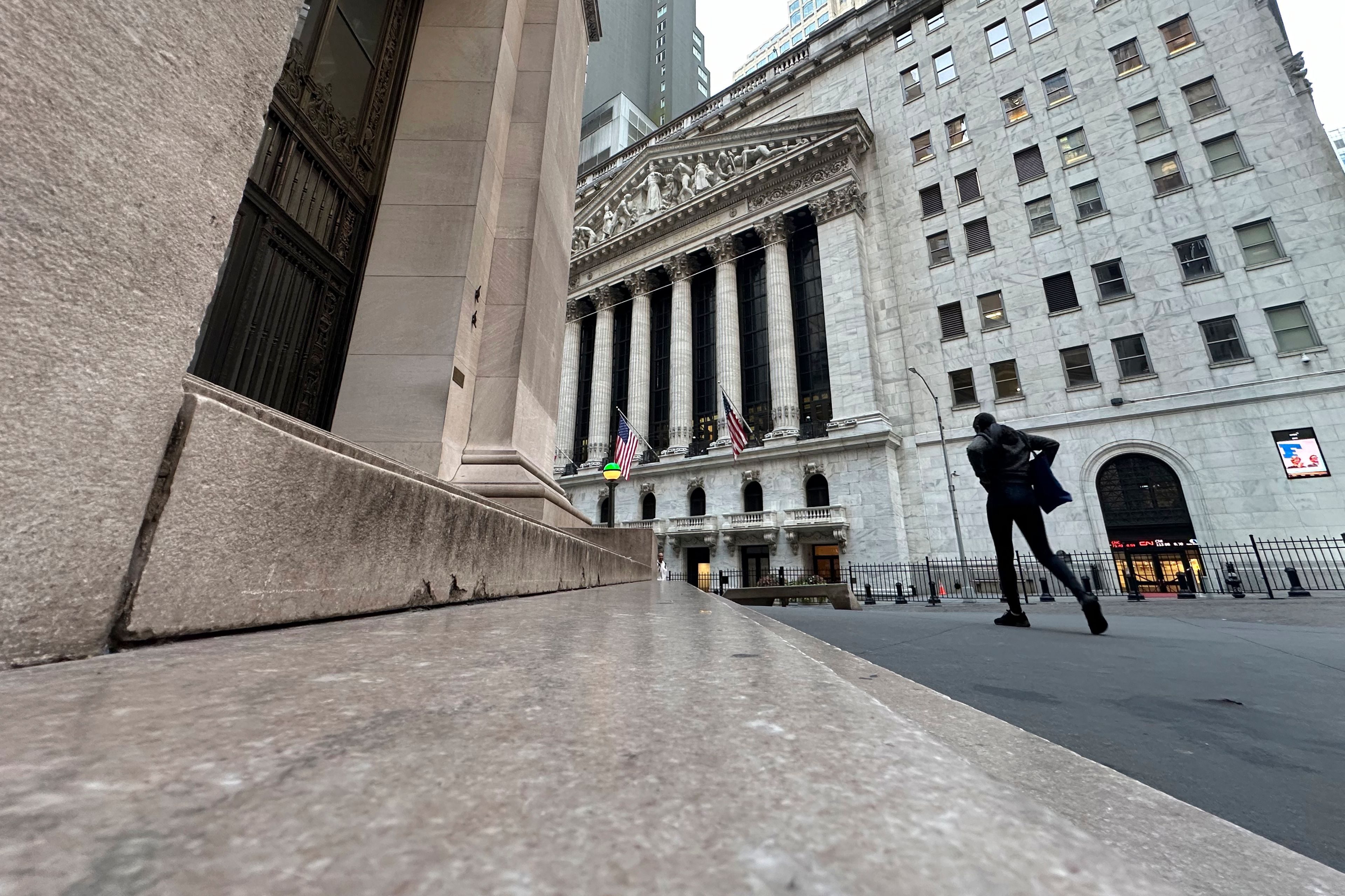 The New York Stock Exchange, rear, is shown on Tuesday, Oct. 8, 2024, in New York. (AP Photo/Peter Morgan, File)