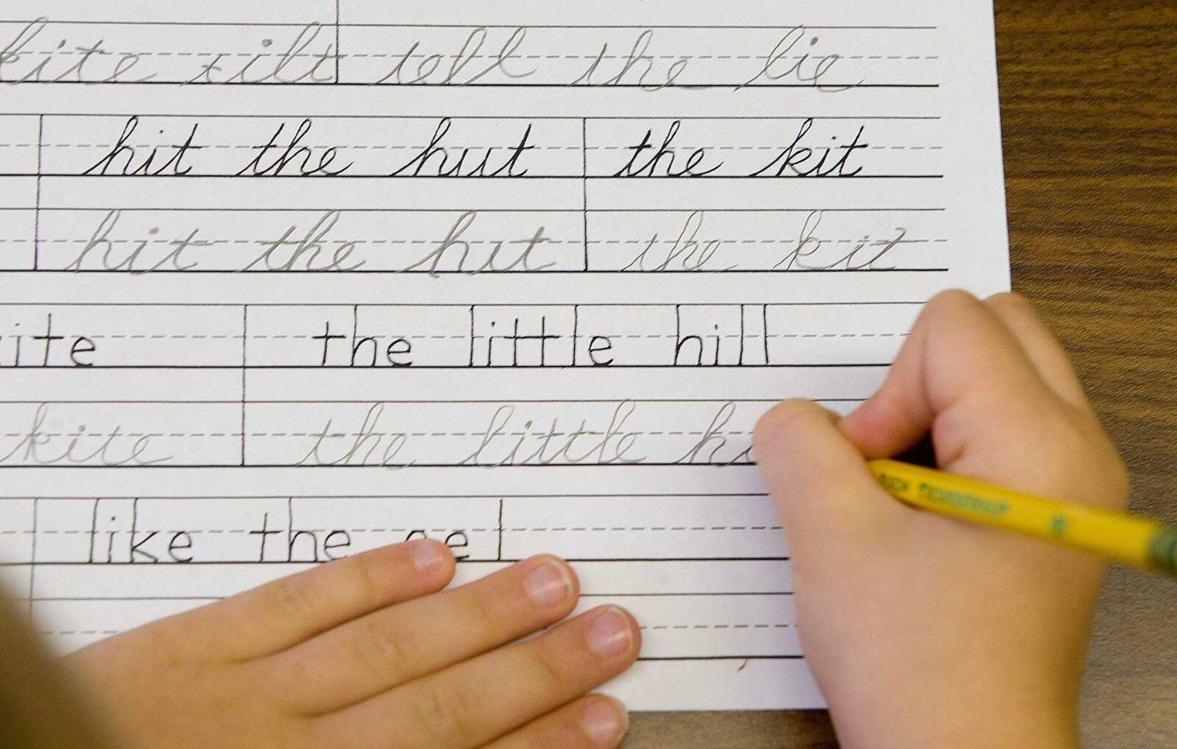 This Sept. 16, 2009 photo shows a student practicing both printing and cursive handwriting skills in the six to nine year old's classroom at the Mountaineer Montessori School in Charleston, W.Va. The decline of cursive is happening as students are doing more and more work on computers, including writing. In 2011, the writing test of the National Assessment of Educational Progress will require 8th and 11th graders to compose on computers, with 4th graders following in 2019. (AP Photo/Bob Bird)