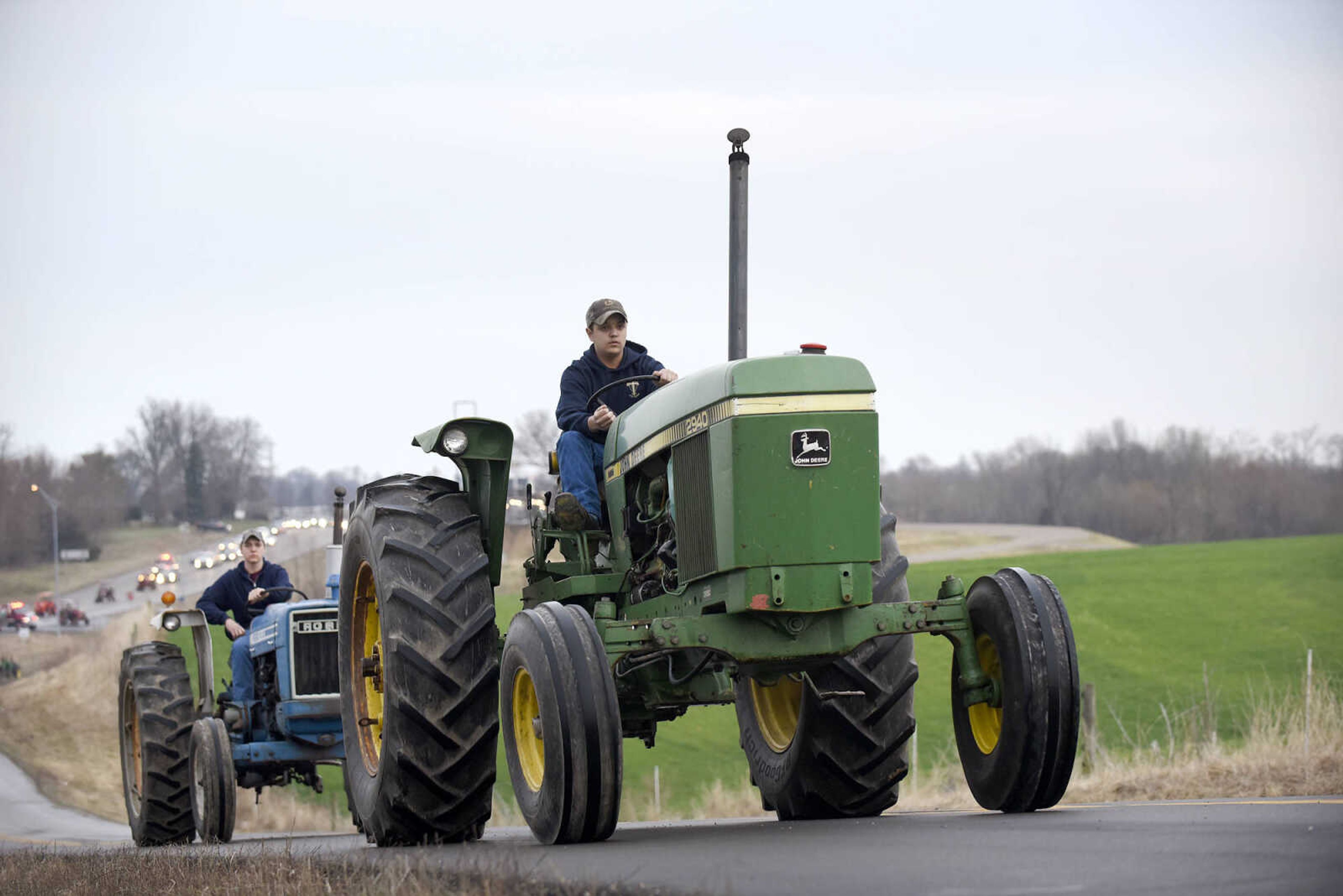 Saxony Lutheran High School FFA students take to the road on their tractors during drive your tractor to school day on Tuesday morning, Feb. 21, 2017. Students began their journey to school from Davis Farm Supply on Highway 61 in Jackson as part of FFA Week.