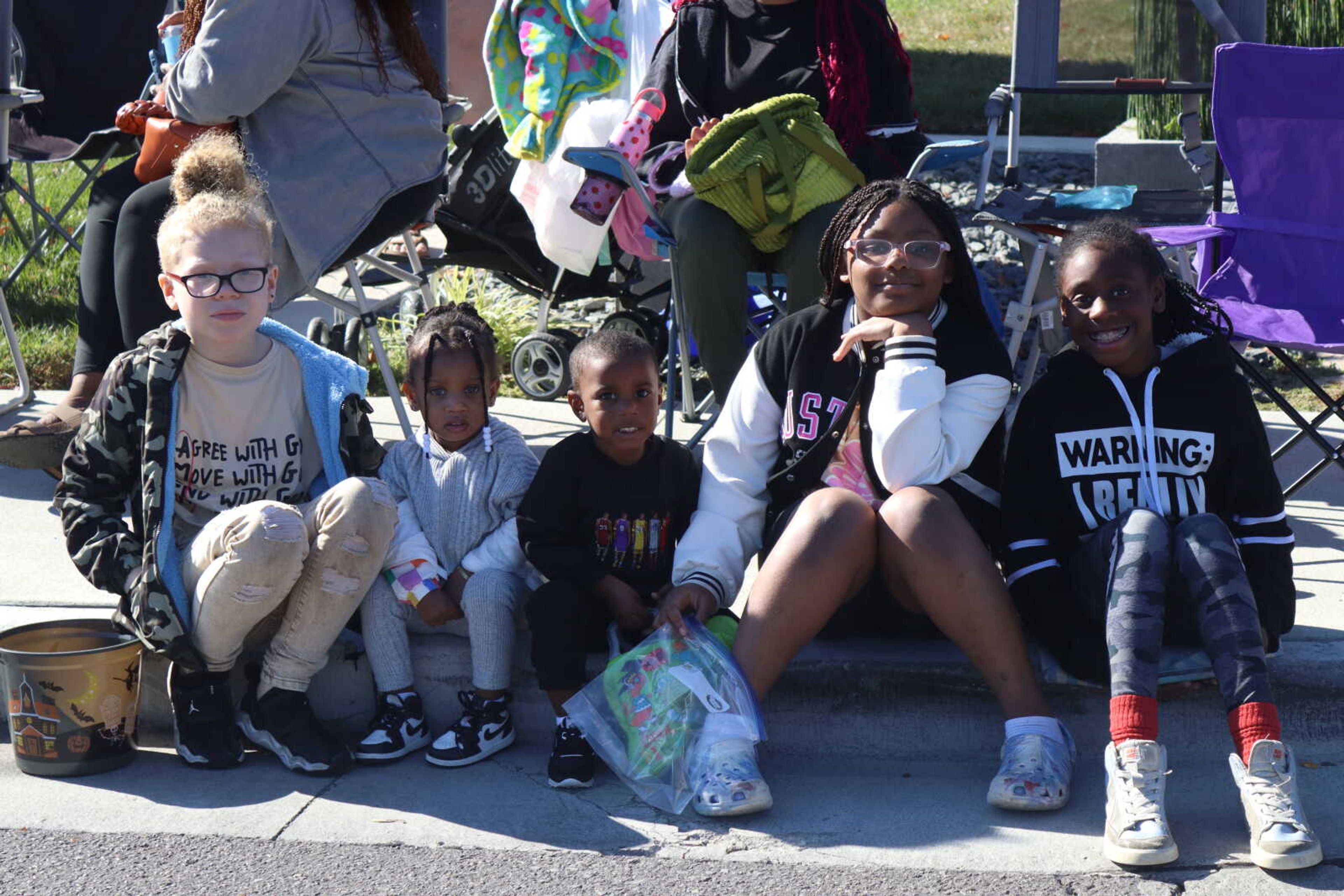 Kai, Kya, That, Jordyn and Kamryn smile as they wait for the parade to start.