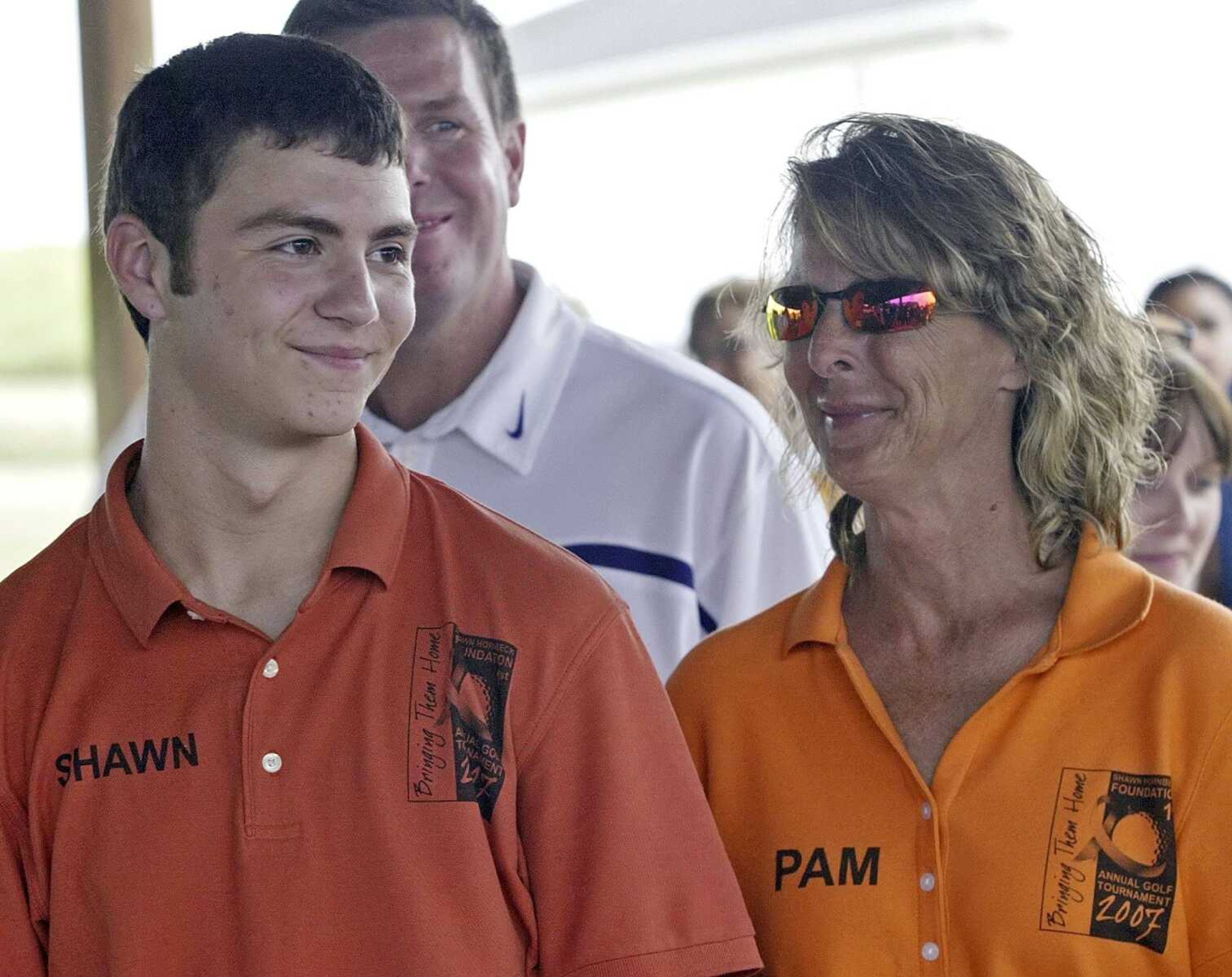 Shawn Hornbeck and his mother, Pam Akers, attend a Shawn Hornbeck Foundation function July 19, 2007, in Madison, Illinois. Kidnapping victims, Shawn, then 15, and Ben Ownby, then 13, were found found Jan. 12, 2007, in the suburban St. Louis apartment of Michael Devlin.