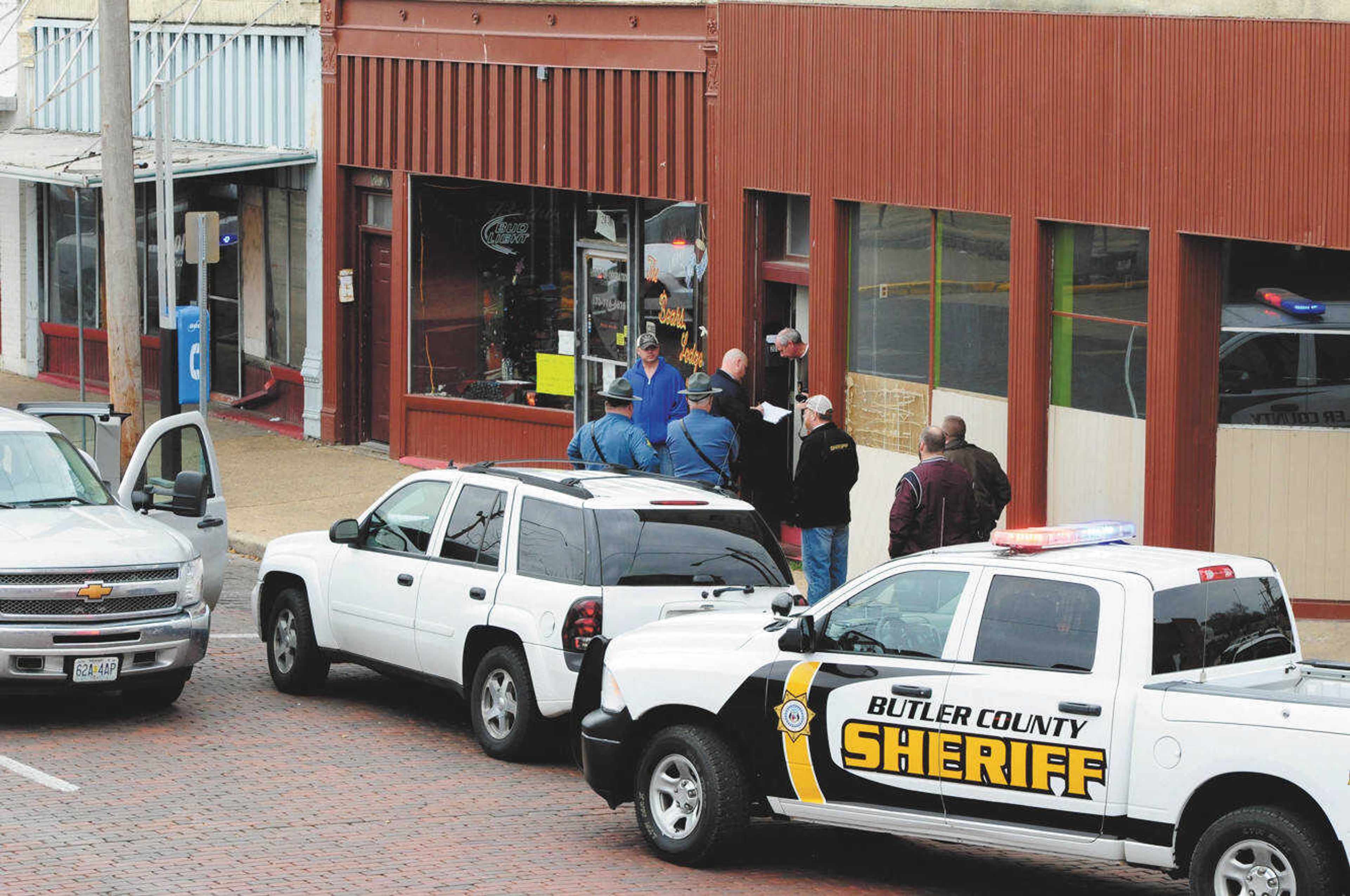 Officers from the Missouri Highway Patrol, Butler County Sheriff's Department and Poplar Bluff Police Department secure the scene of a shooting in downtown Poplar Bluff Friday. (Photo courtesy of the Daily American Republic/Paul Davis)