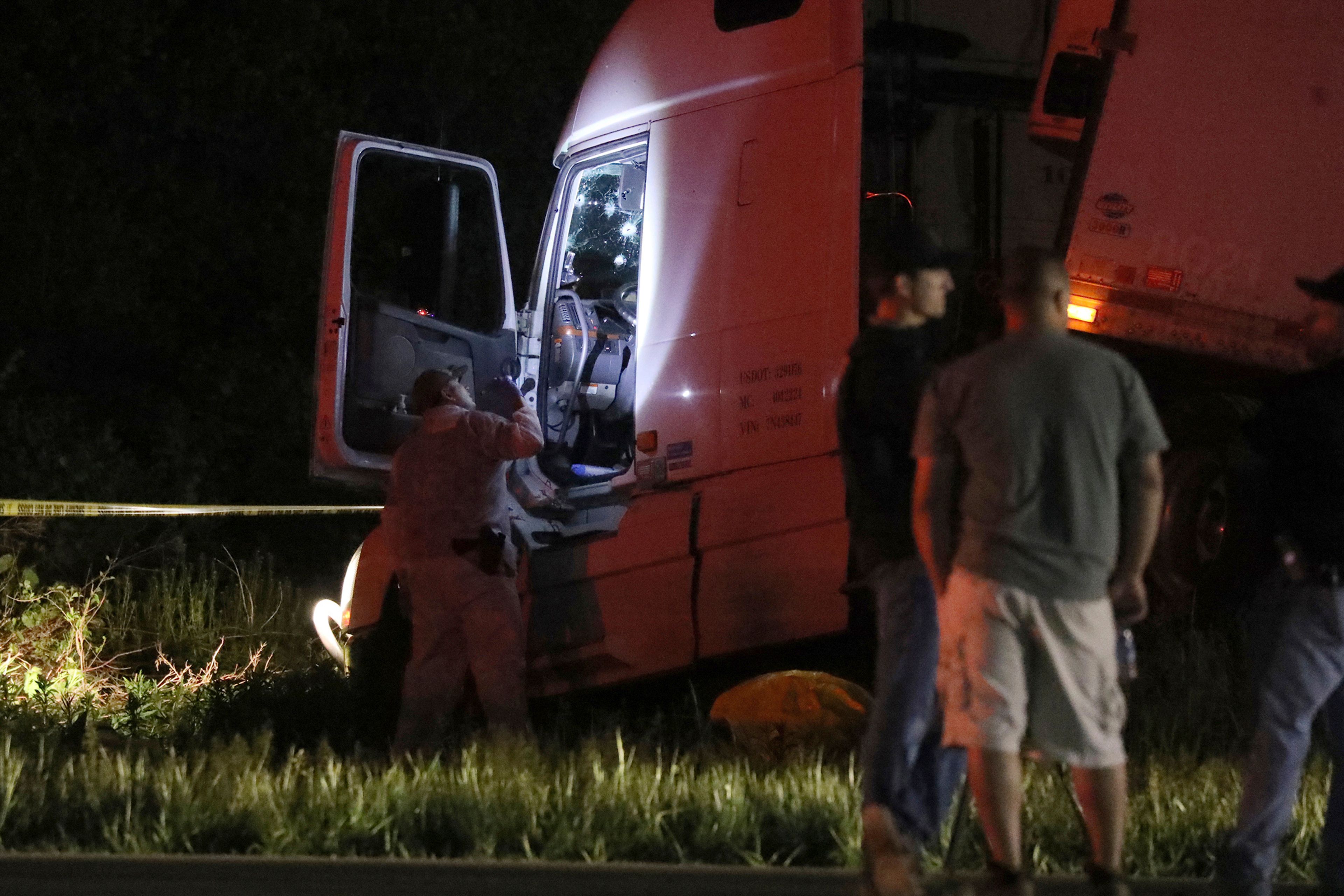 A Livingston County Sheriff investigator looks over the cab of a tractor trailer after driver Joshua Blessed was killed during a shootout with law enforcement officers on Rt. 20A in Geneseo, N.Y., on Wednesday, May 27, 2020. The incident started in LeRoy, N.Y., when police stopped the tractor trailer for speeding. Blessed took off and drove into Livingston County, leading law enforcement on a chase. (Tina MacIntyre-Yee/Democrat & Chronicle via AP, File)