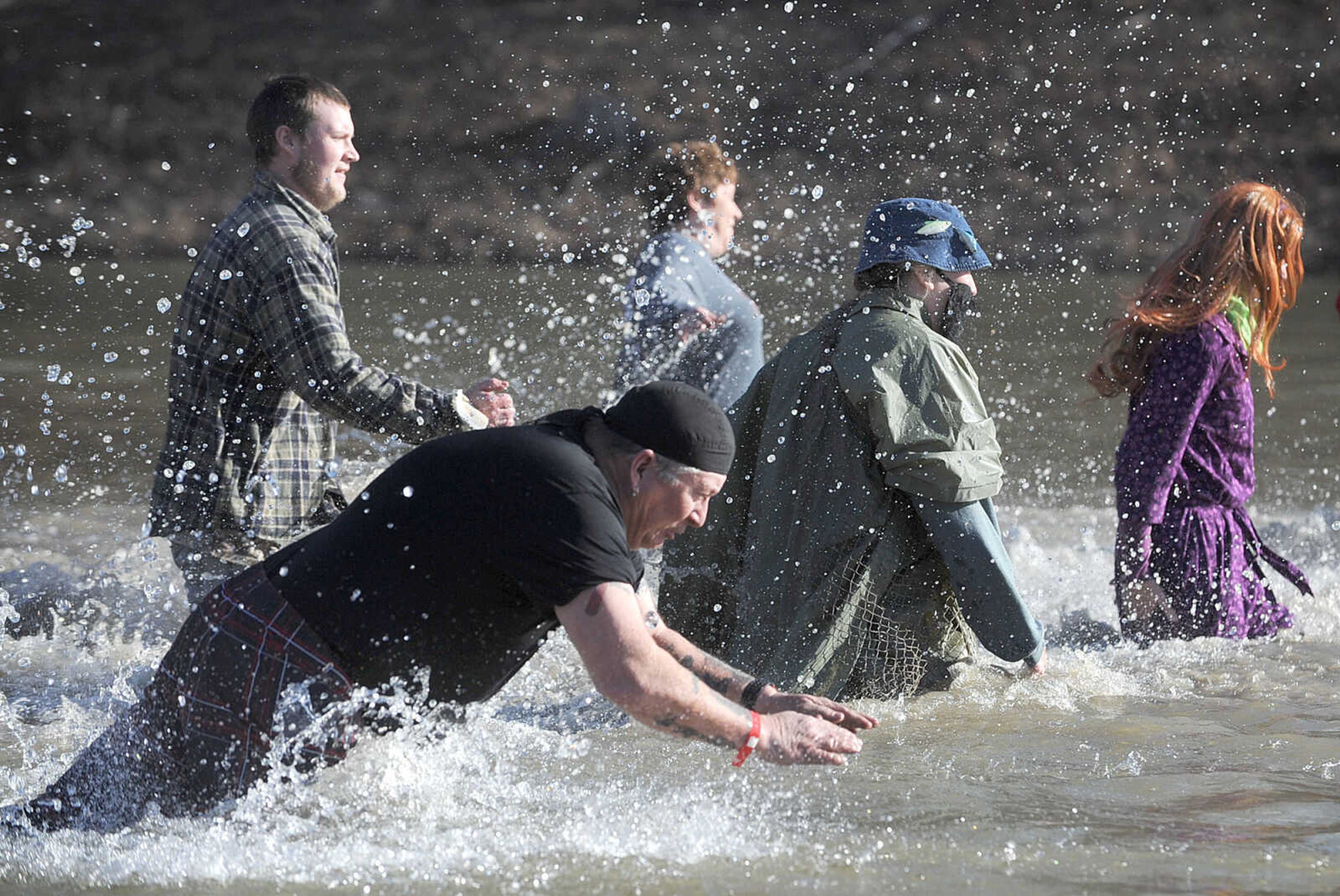 LAURA SIMON ~ lsimon@semissourian.com
People plunge into the cold waters of Lake Boutin Saturday afternoon, Feb. 2, 2013 during the Polar Plunge at Trail of Tears State Park. Thirty-six teams totaling 291 people took the annual plunge that benefits Special Olympics Missouri.