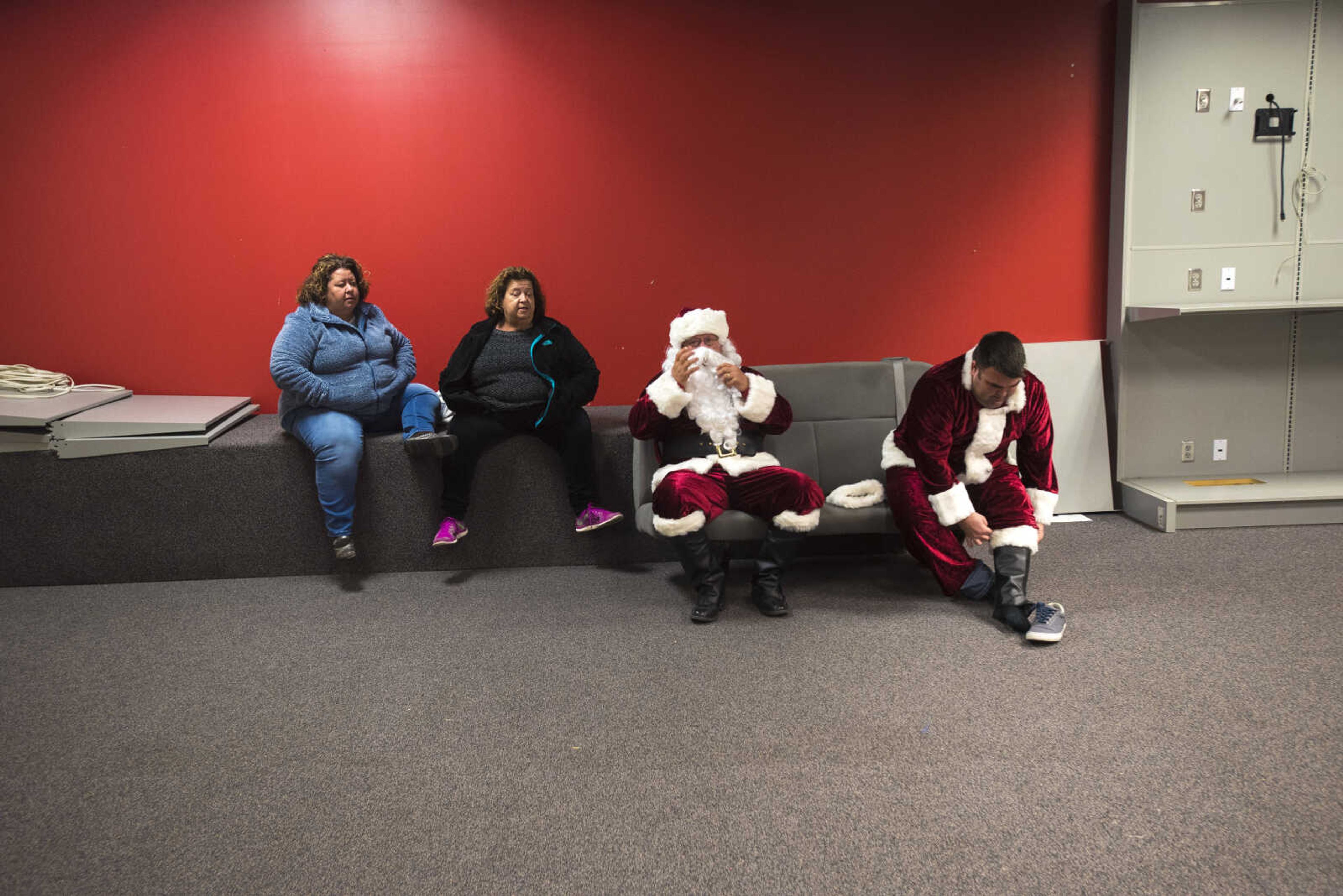 Santa's get ready during the Jaycee Toybox delivery on Thursday, Dec. 21, 2017, in Cape Girardeau.