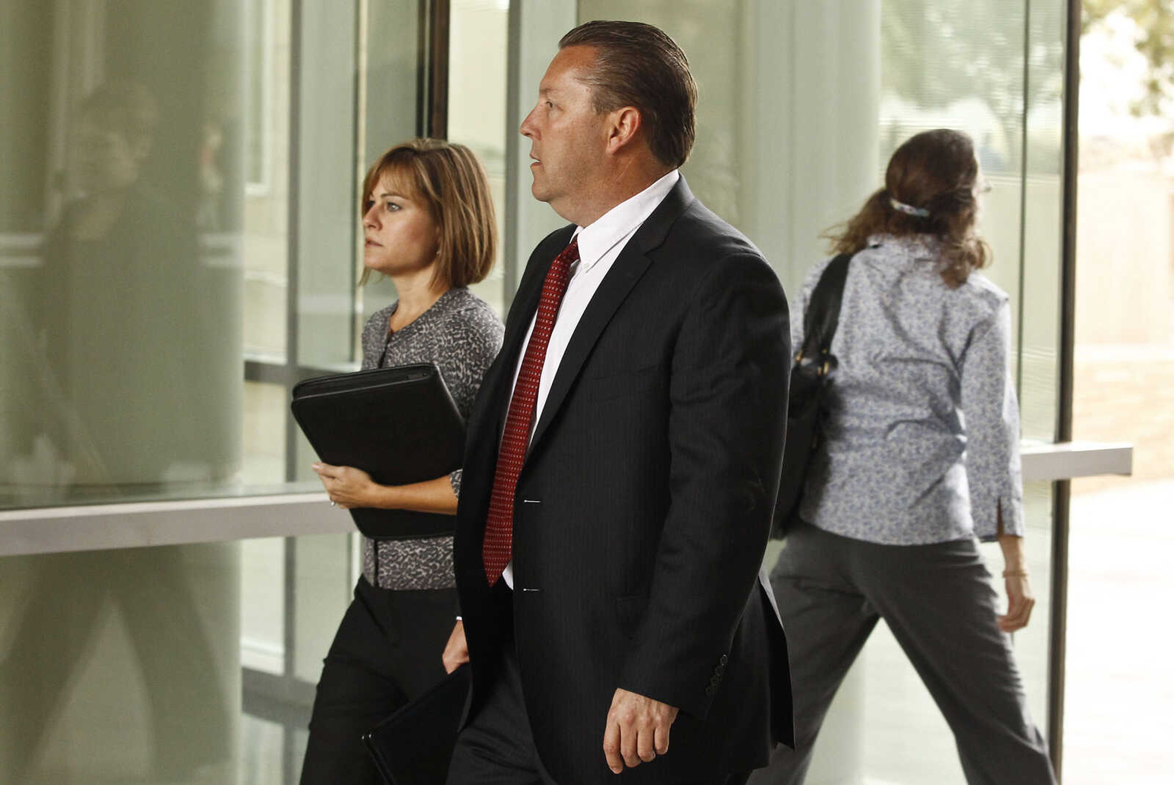 FBI Special Agent in Charge in Phoenix, James Turgal, front, arrives at U.S. District Court prior to the sentencing of Jared Lee Loughner, Thursday, Nov. 8, 2012, in Tucson, Ariz.  Loughner, who killed six people and wounded 13 others in an Arizona shooting rampage, is to be sentenced Thursday at a hearing that some victims of the attack, including former Rep. Gabrielle Giffords, are expected to attend.  Loughner has pleaded guilty to federal charges in the January 2011 attack at a Giffords political event in Tucson.(AP Photo/Ross D. Franklin)