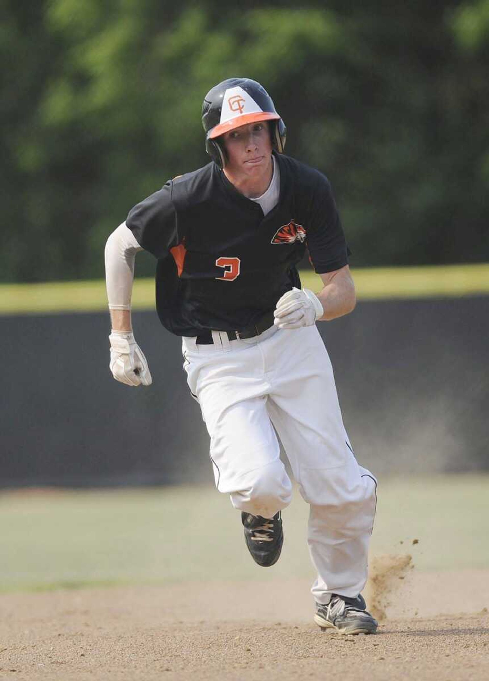 Central senior Vance Toole scores on a home run by Ramsey Scott during the first inning.