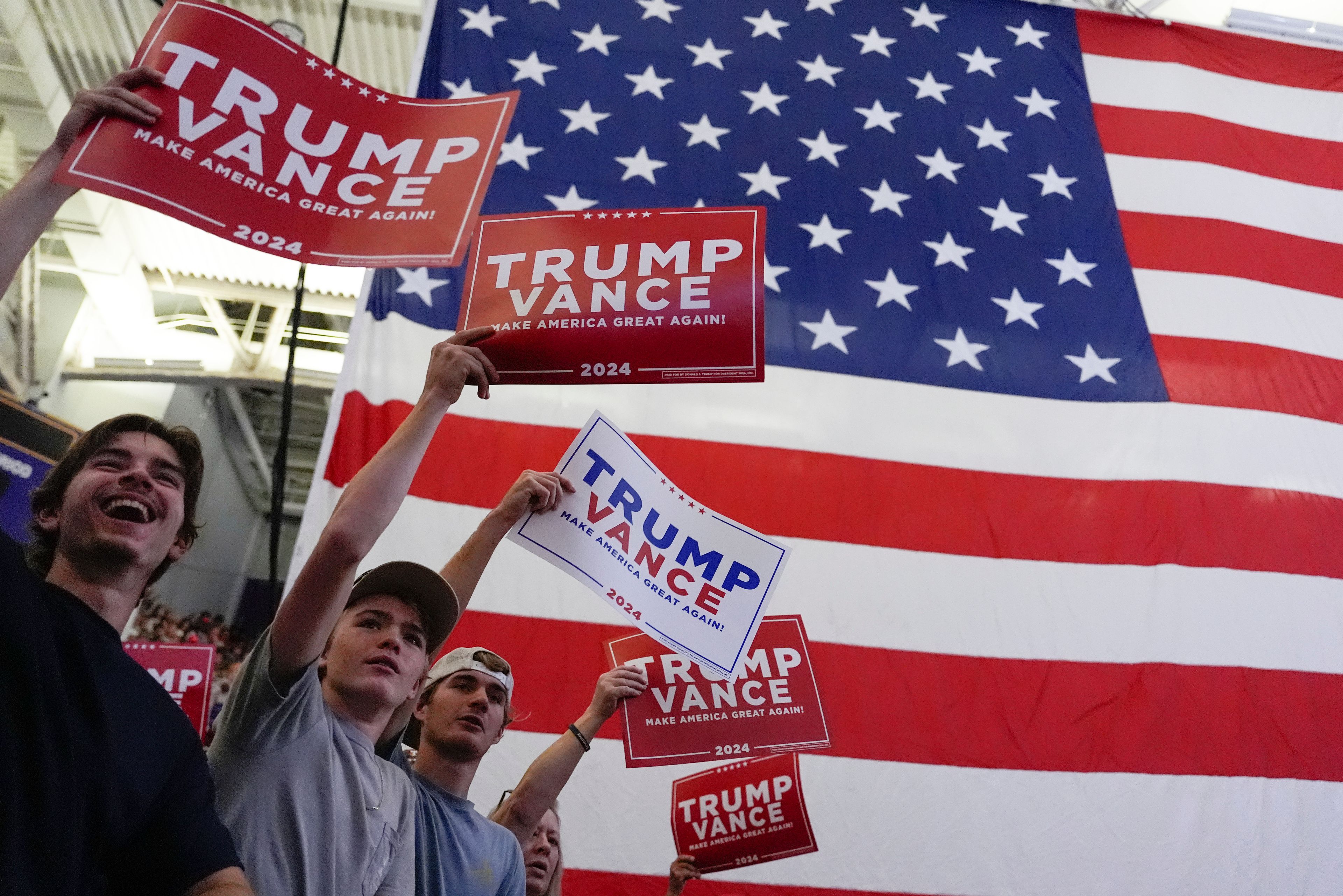 Supporters listen as Republican presidential nominee former President Donald Trump speaks at a campaign rally at Minges Coliseum, Monday, Oct. 21, 2024, in Greenville, N.C. (AP Photo/Julia Demaree Nikhinson)