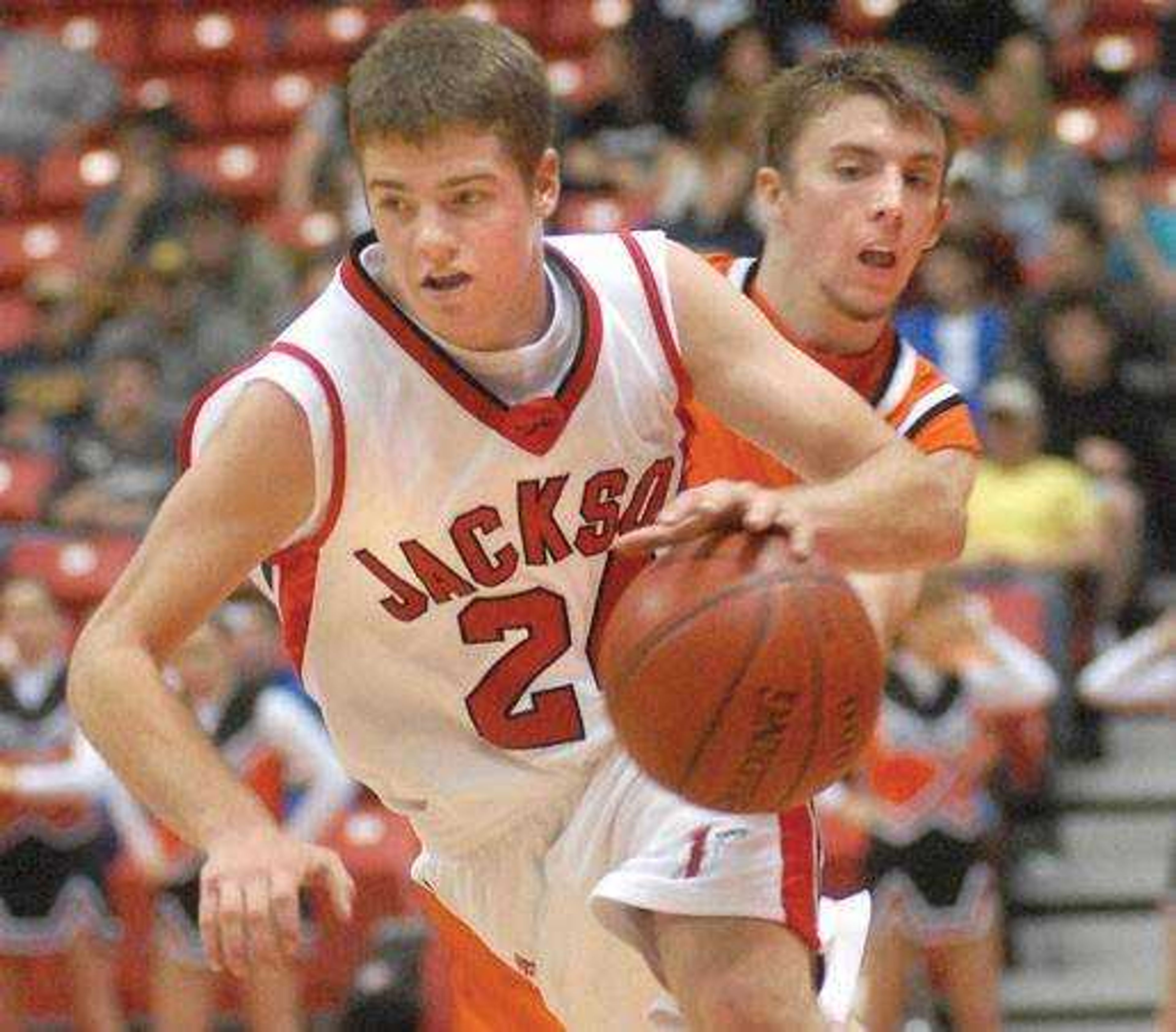 Jackson's Matt Lang dribbled away from Advance's Jacob Bond in the fourth quarter Wednesday at the Southeast Missourian Christmas Tournament. (Aaron Eisenhauer)