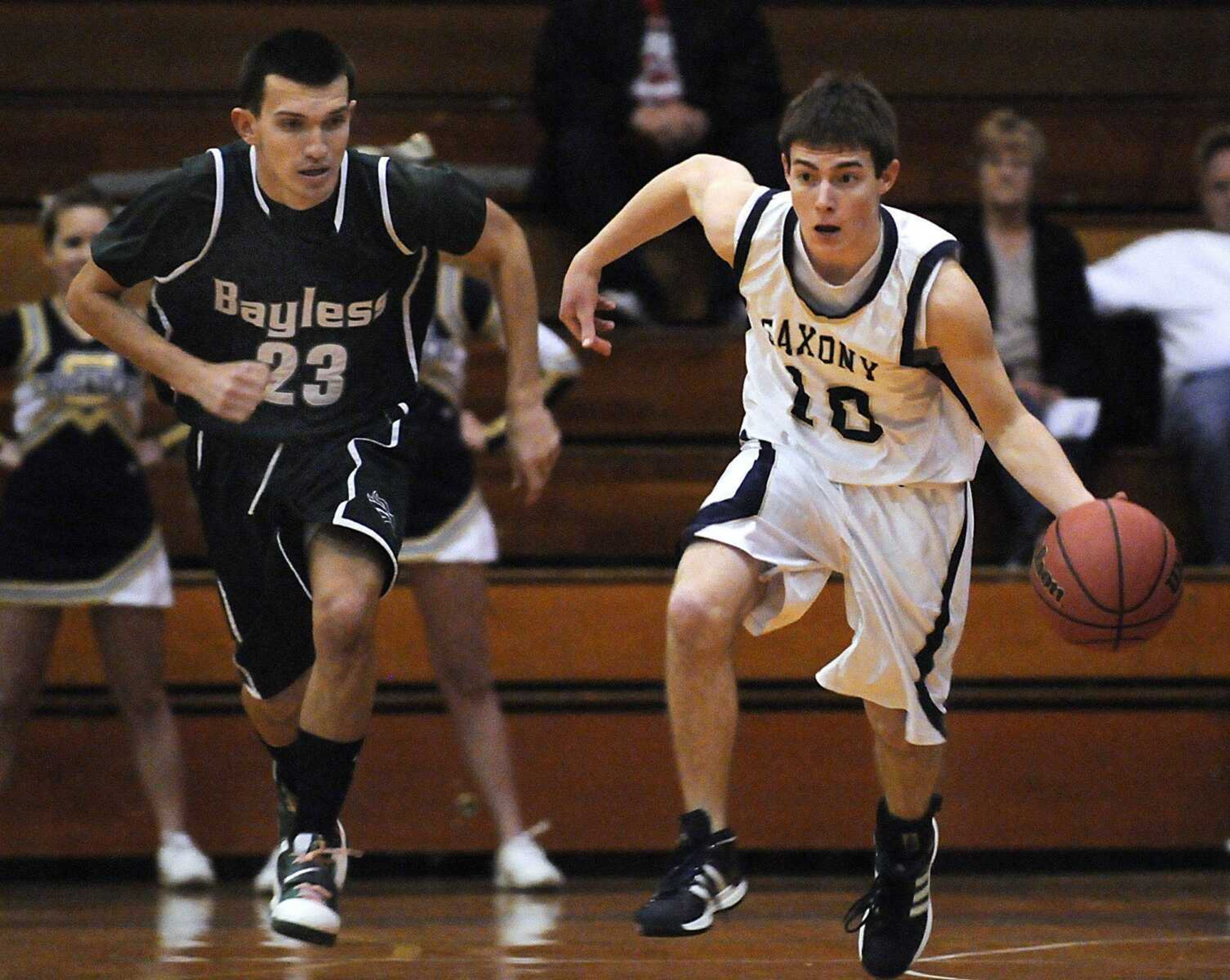 Saxony Lutheran's Trent Steffens and Bayless' Edmir Oric race up the floor during the second quarter of the Class 3 sectional game Wednesday at Jefferson College in Hillsboro, Mo.