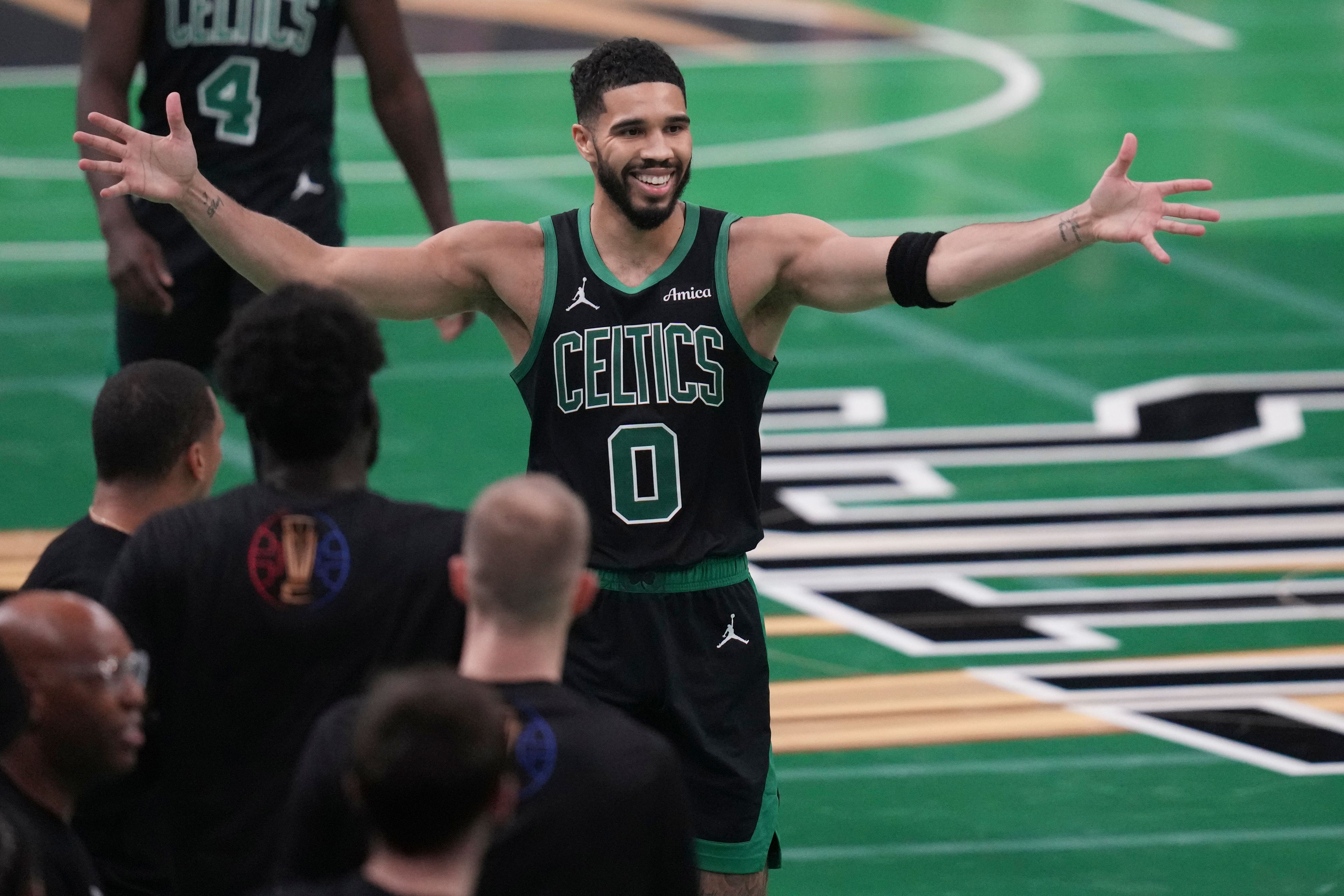 Boston Celtics forward Jayson Tatum (0) celebrates during the second half of an Emirates NBA Cup basketball game against the Cleveland Cavaliers, Tuesday, Nov. 19, 2024, in Boston. (AP Photo/Charles Krupa)