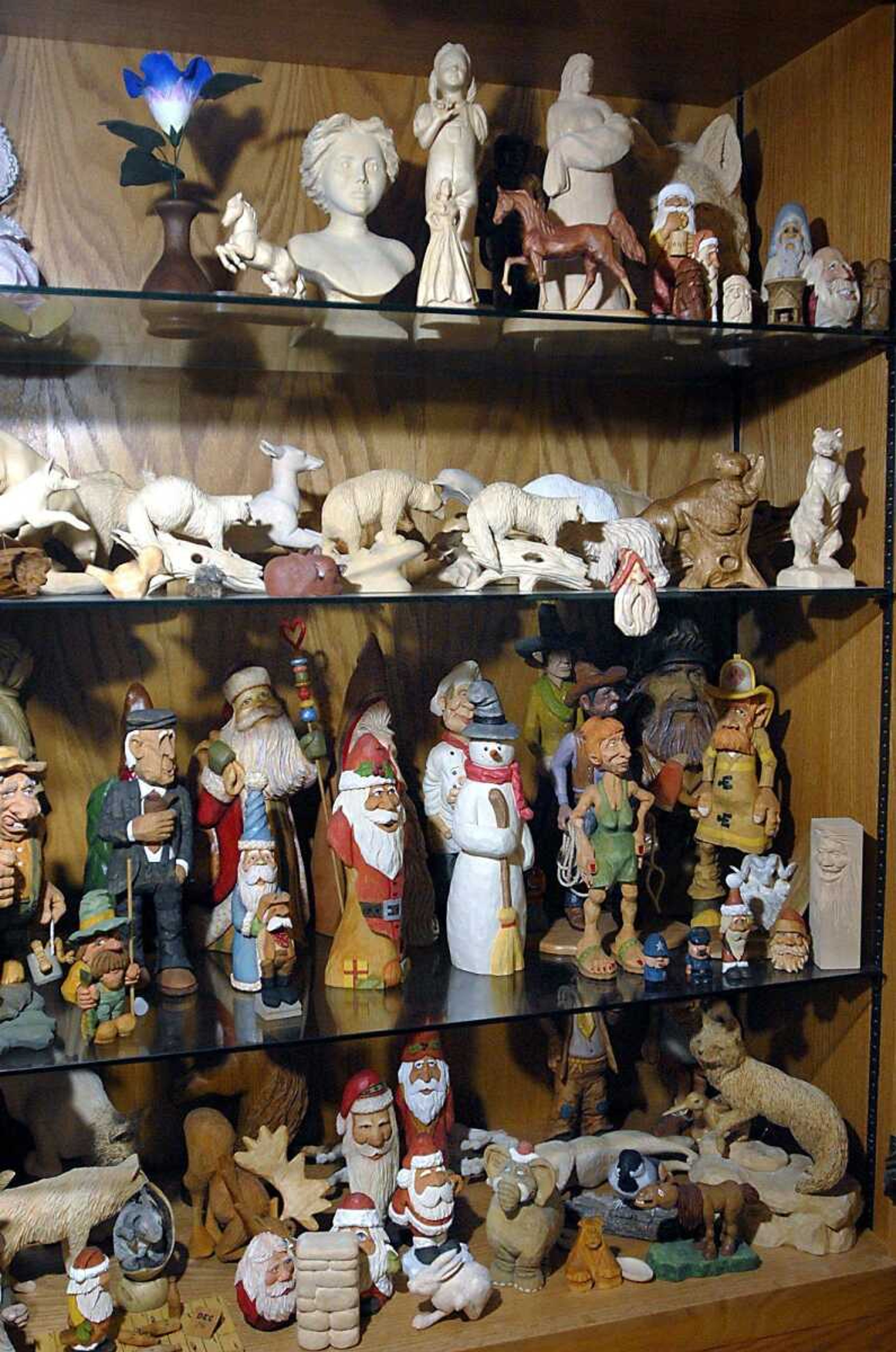 The Ledure home has many carvings on display. They range in size, carving style, subject, and carving medium. (Kit Doyle)