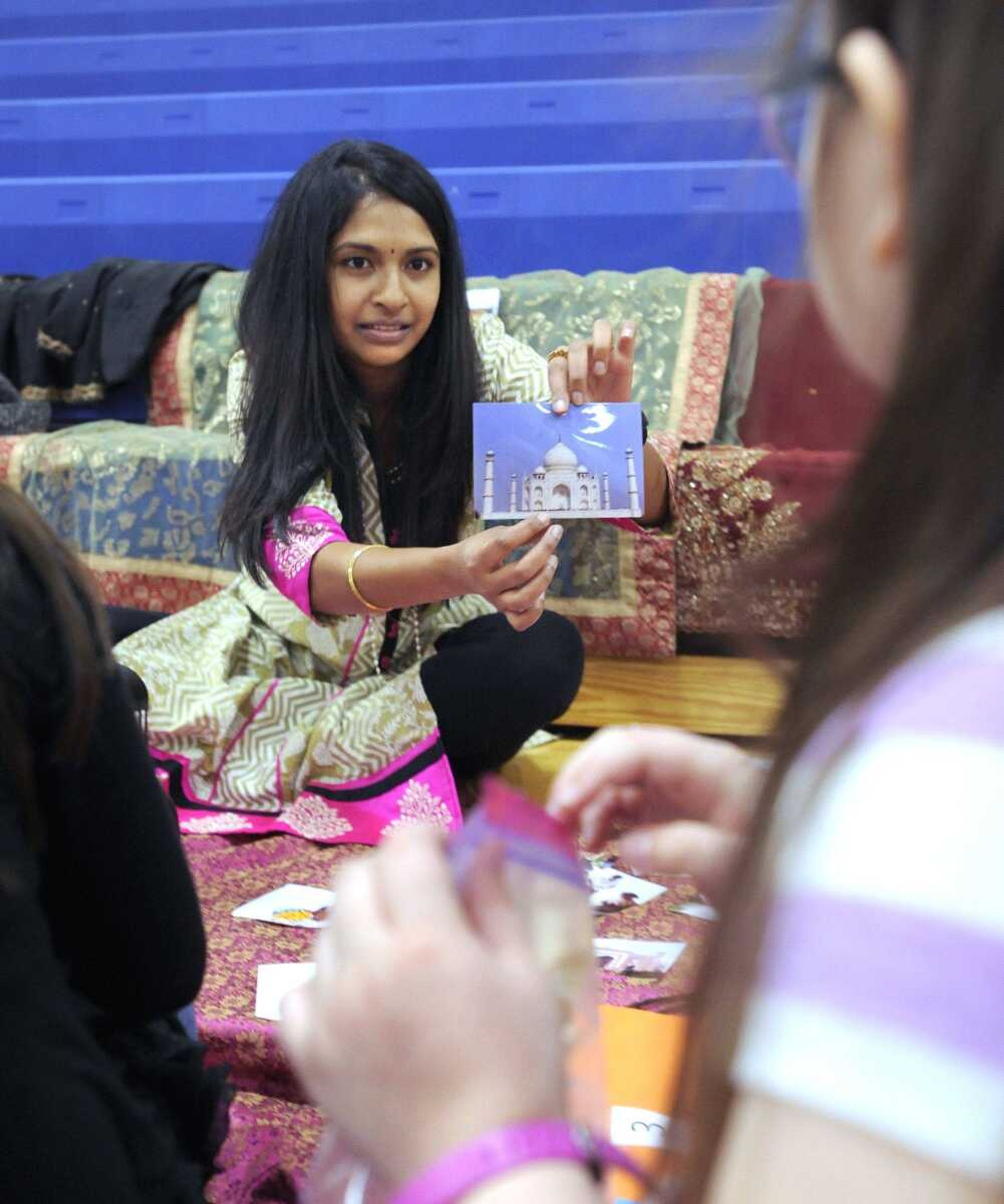 Shvetha Gohn, a native of India, show a picture of the Taj Mahal to students Wednesday at Oran Elementary School in Oran, Missouri.