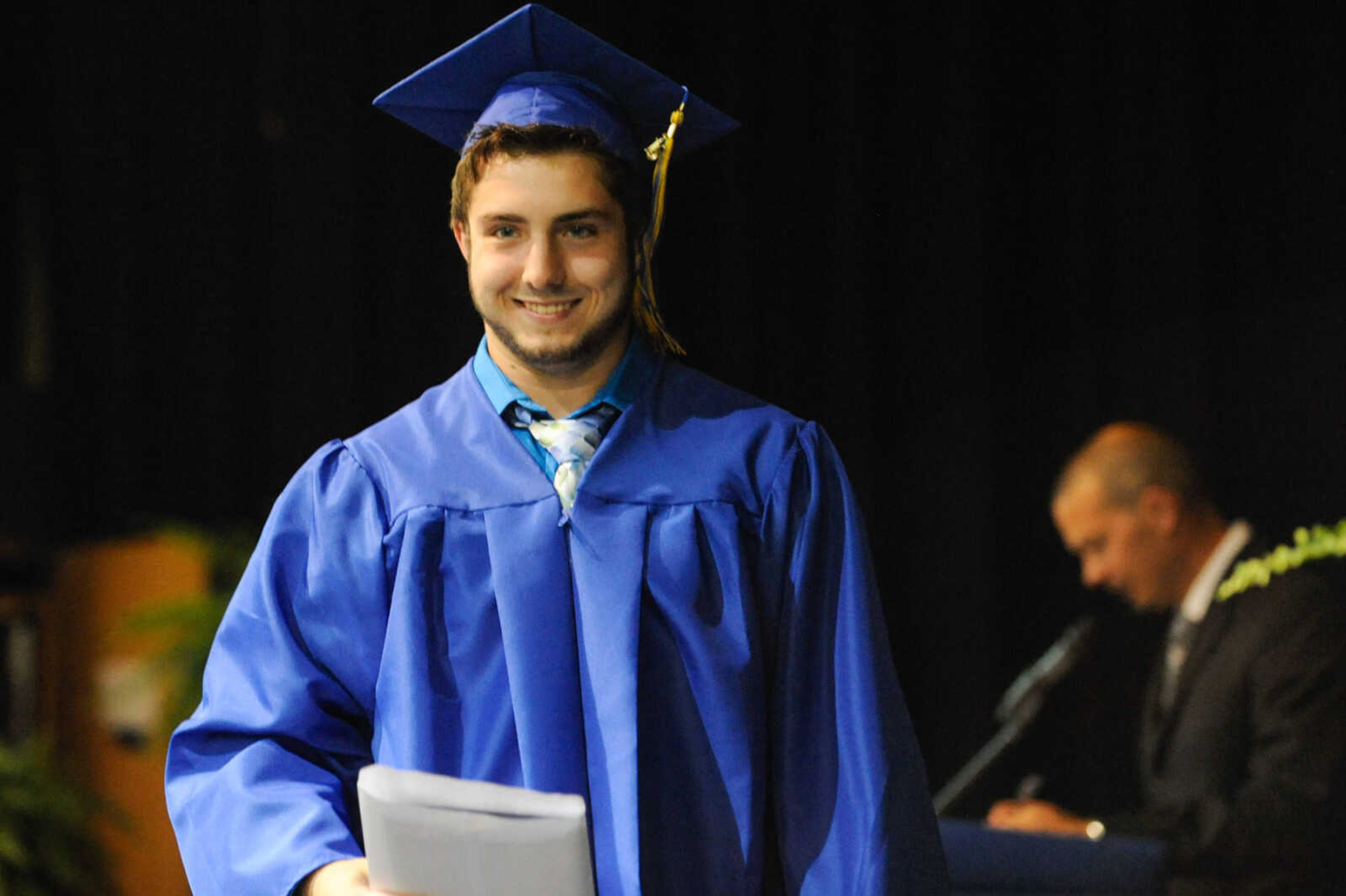 GLENN LANDBERG ~ glandberg@semissourian.com

Jake Elders accepts his diploma during the Scott City commencement Sunday, May 17, 2015 at Scott City High School.