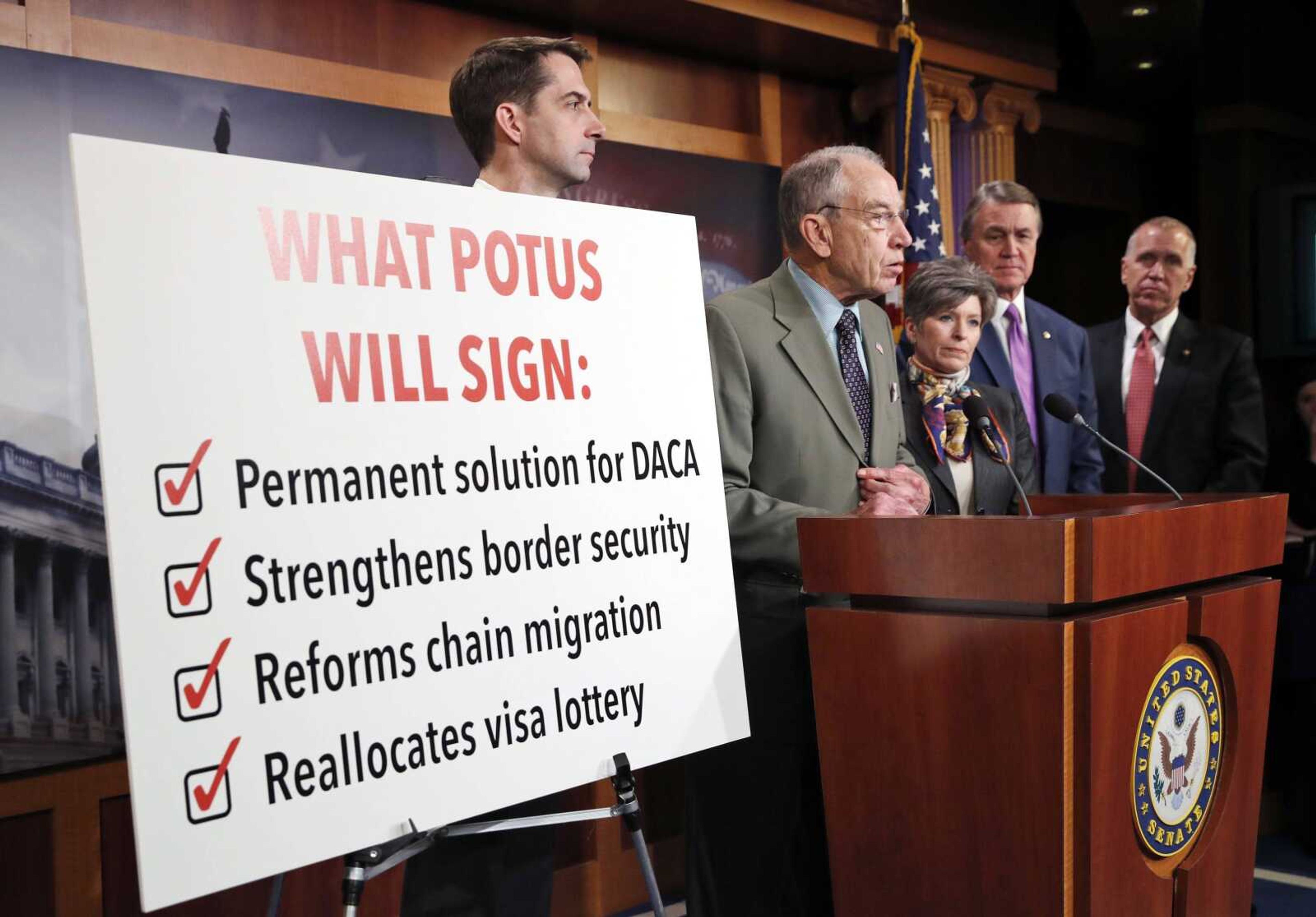 Sen. Chuck Grassley, R-Iowa, second from left, speaks Monday accompanied by Sen. Tom Cotton, R-Ark., left, Sen. Joni Ernst, R-Iowa, Sen. David Perdue, R-Ga., and Sen. Thom Tillis, R-N.C., during a news conference about an immigration bill on Capitol Hill in Washington.